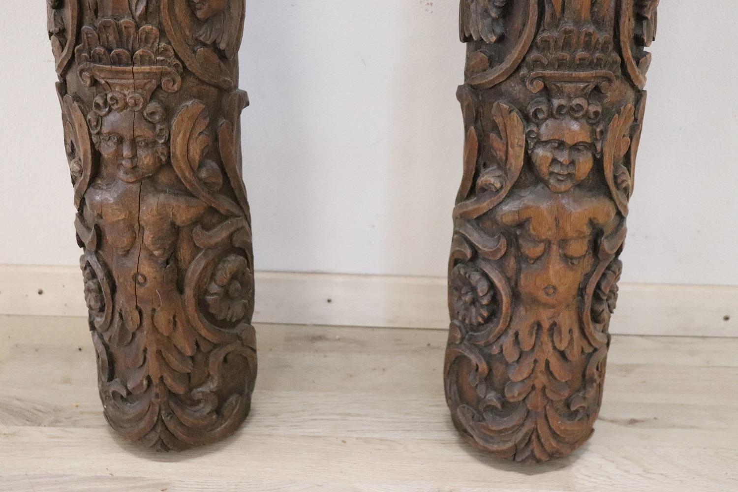Rare 18th century pair of antique walnut wood columns. Spectacular hand-carved decoration in wood.