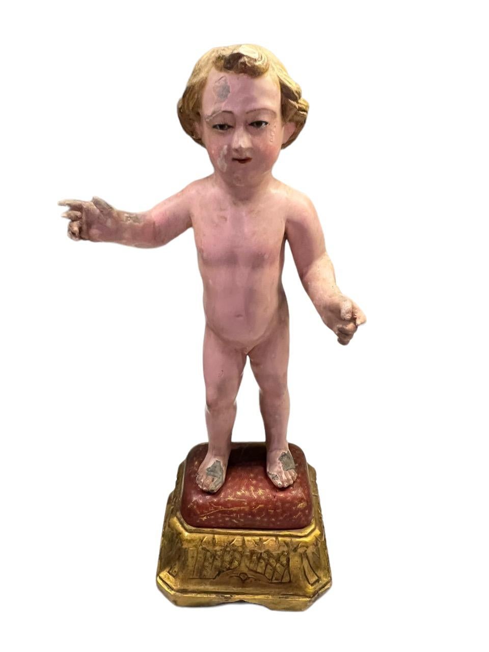 Figura italiana del siglo XVIII tallada en madera y policromada que representa al Niño Jesús Rococó en venta