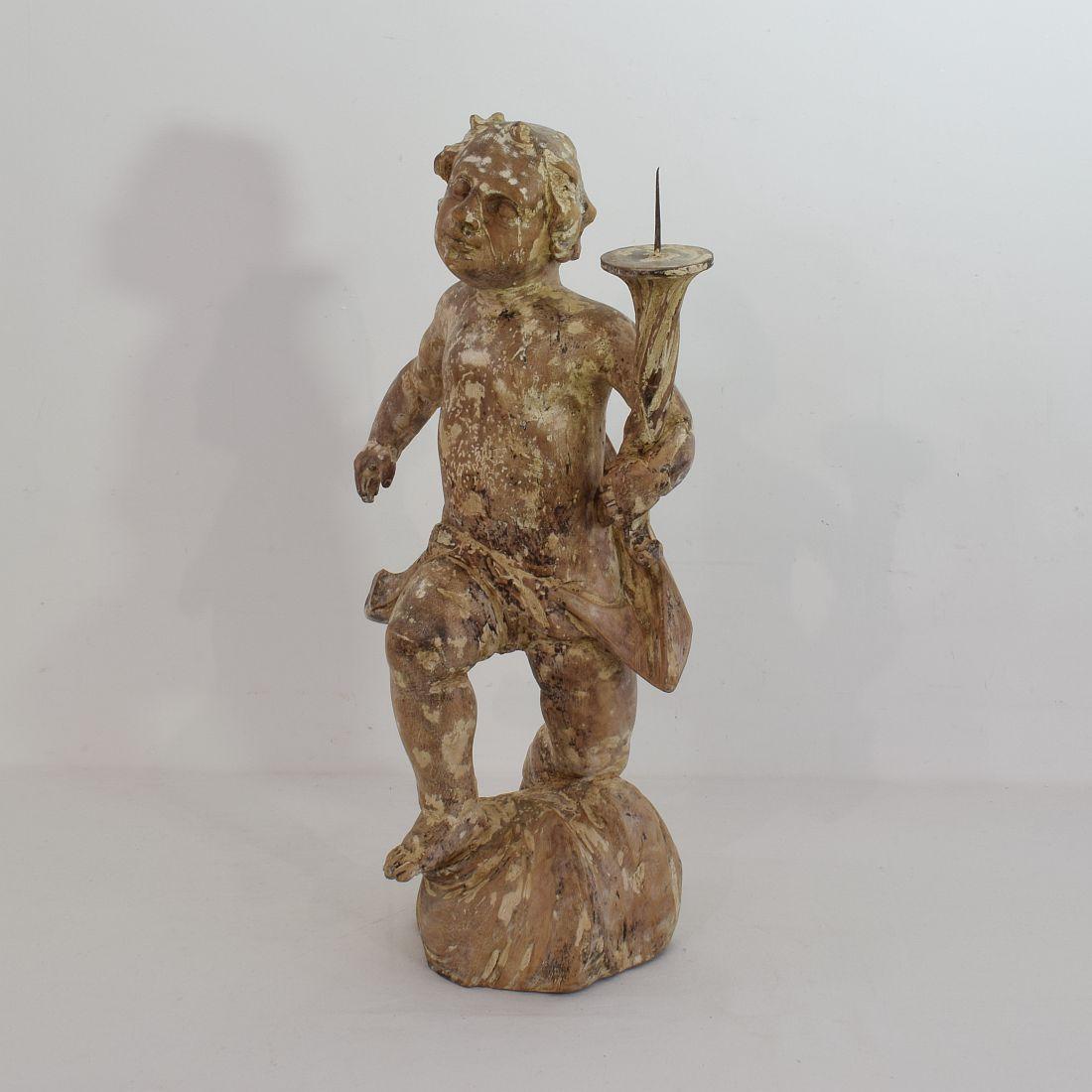 Stunning period piece. Baroque angel with candleholder. Traces of old chalk paint visible.
Very beautiful item,
Italy, circa 1750. Weathered, old repairs and losses.
    