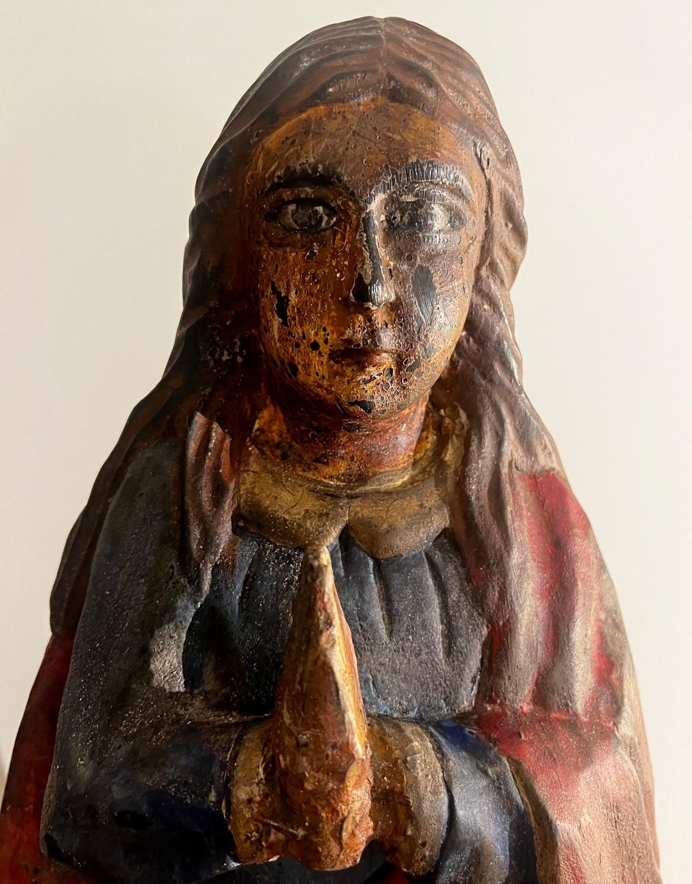 This is an outstanding Italian 18th century carved wood polychromed sculpture of Virgin Mary. The Sculpture is hand painted with some remains of a gold gilt in few places and originated until lately in a private Villa in Tuscany (Italy). The colors