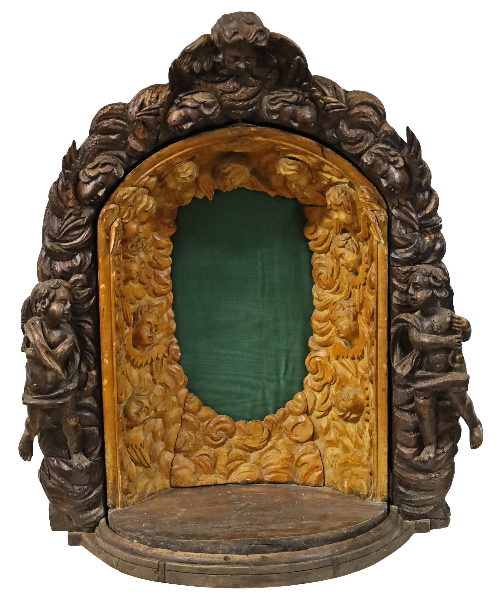 Wonderfully carved 18th century Italian tabernacle cabinet, surrounded by cherubs facing the rotating dome form cabinet, a crucifix center mounted. This cabinet is a statement piece that can hold a curiousity or conversation starter