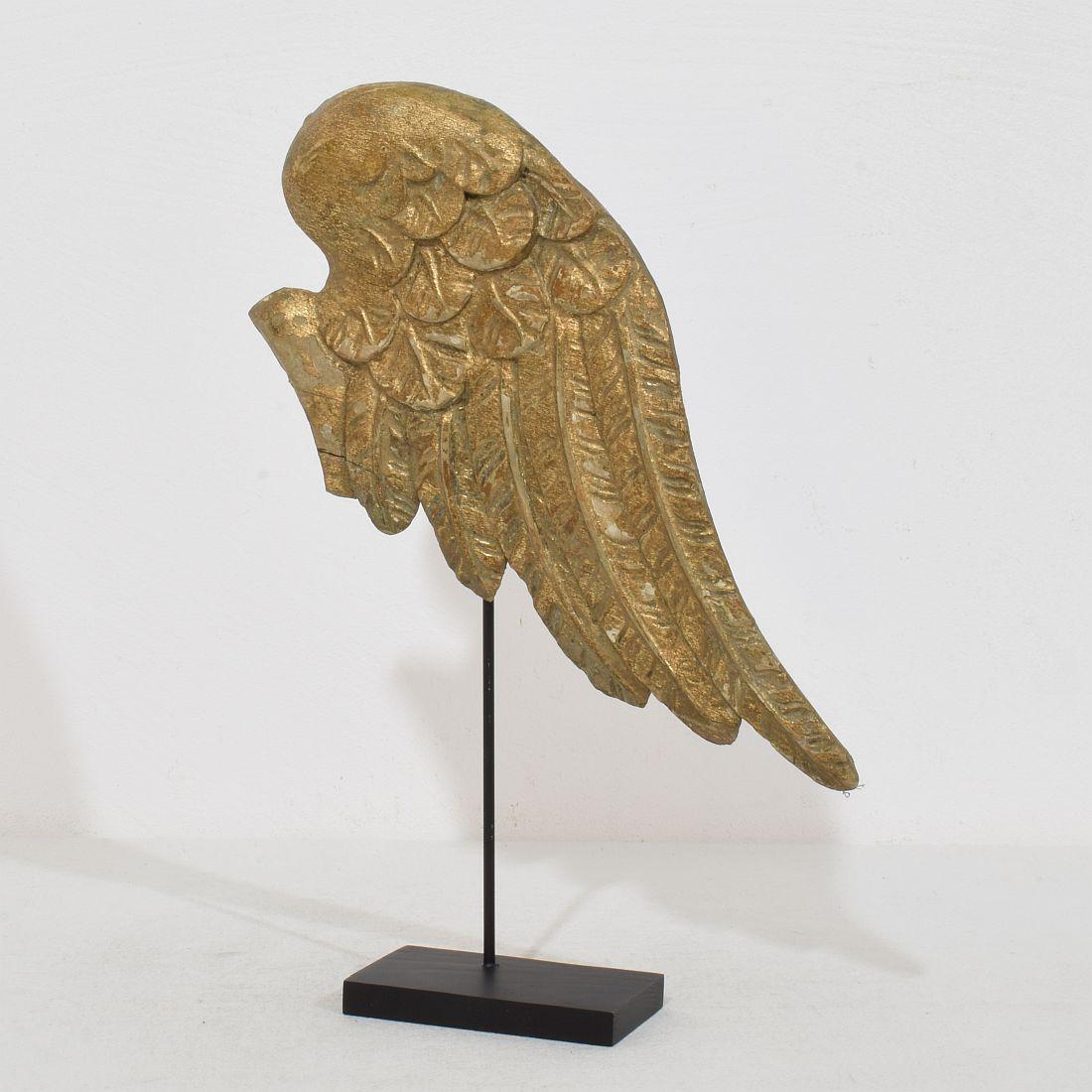Beautiful Baroque angel-wing. Rare and very decorative item placed on a wooden base, Italy, circa 1750. Weathered. Measurement is inclusive the wooden base.
H:32,5cm  W:22cm D:5,5cm 
