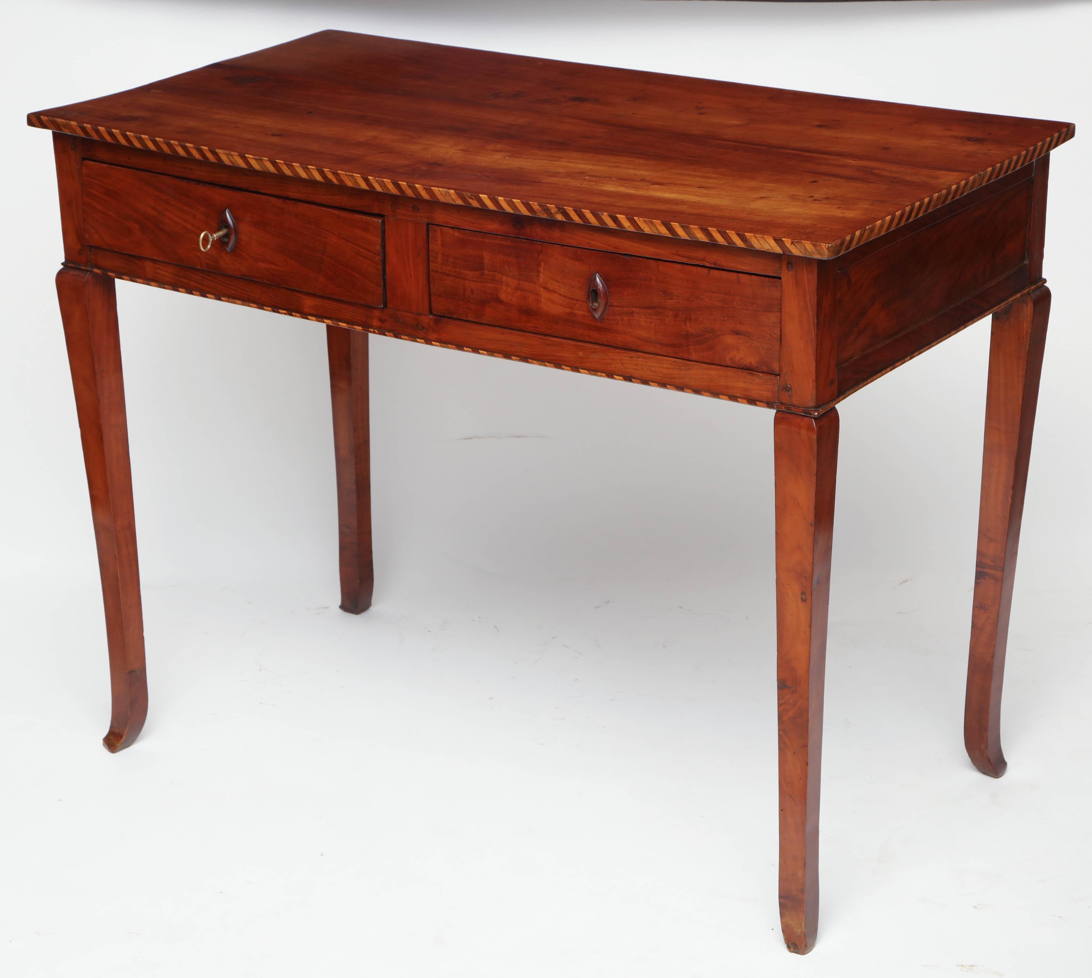 Cherry table with two drawers, parquetry border, finished back, carved wood escutcheons and tapered legs, Italy, circa 1780.

Overall dimensions: 41.5” W, 22” D, 31.5” H


Available to see in our NYC Showroom 
BK Antiques
306 East 61st St. 2nd