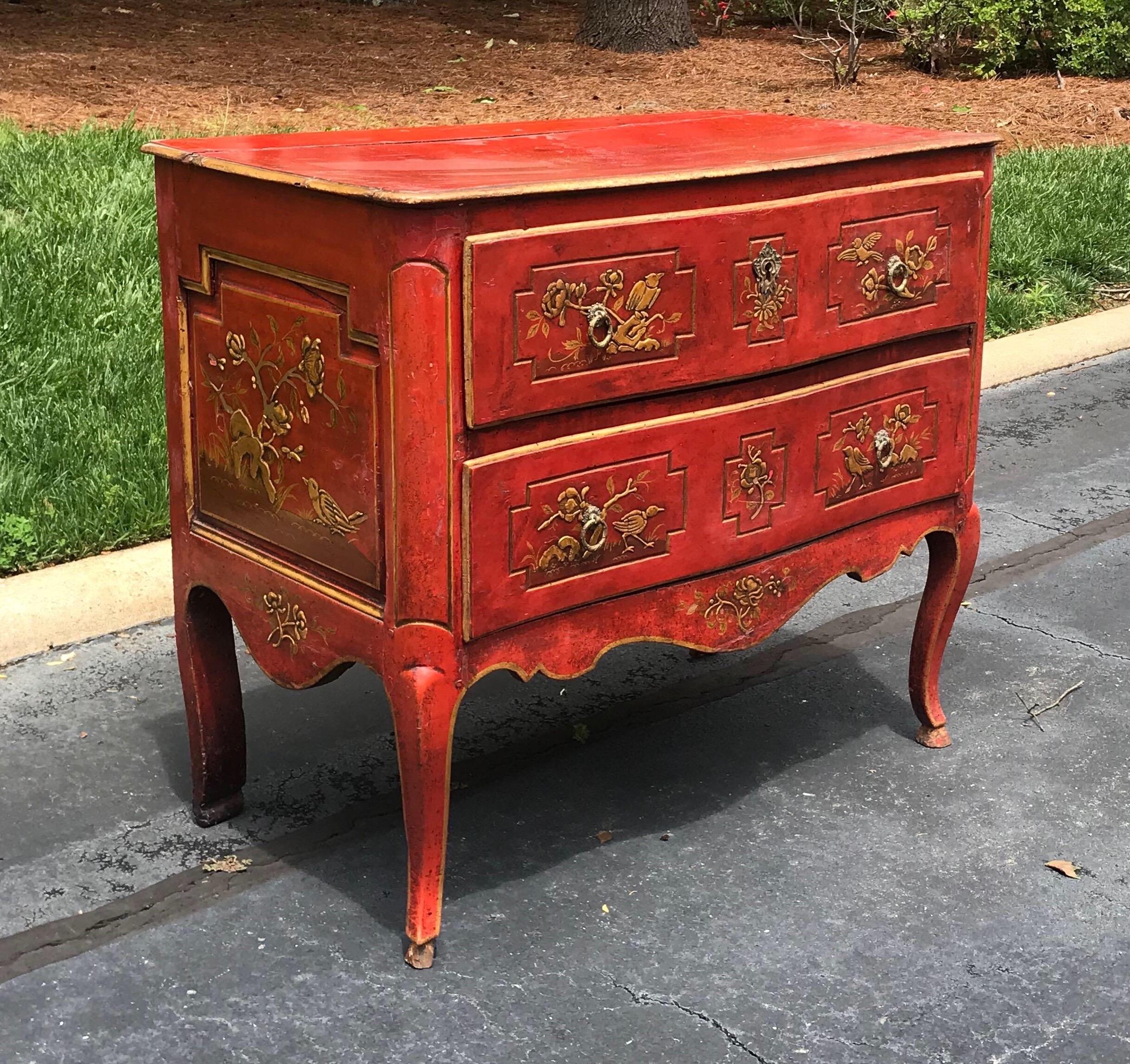 Incredible red lacquered Italian chinoiserie 2 drawer commode with paneled sides and shaped top in a serpentine form.