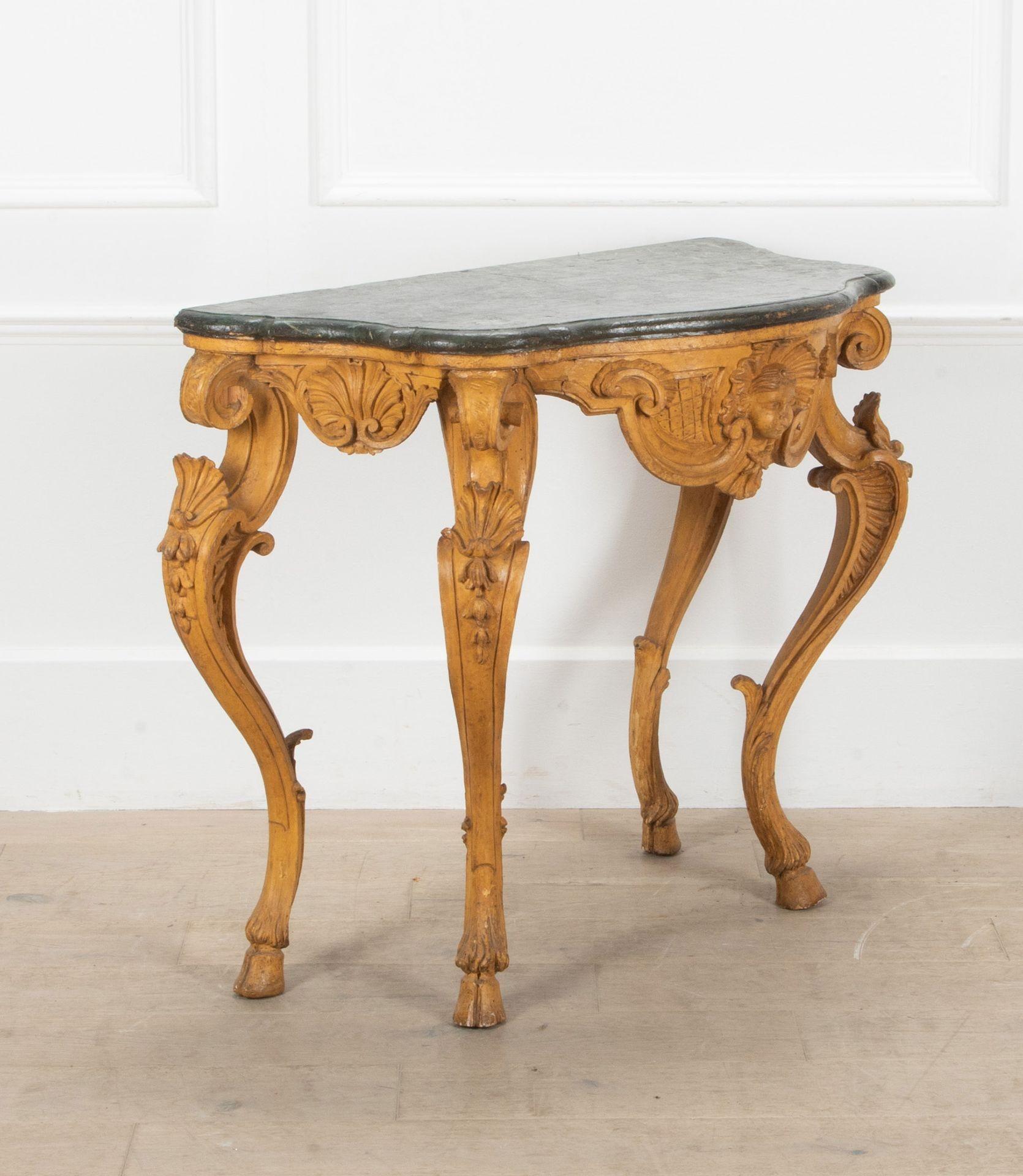 A fabulous 18th Century Italian Piedmontese console table.
With original faux marble top and incredible carved wooden legs terminating on hairy hoof feet.
With some restoration. Circa 1760.