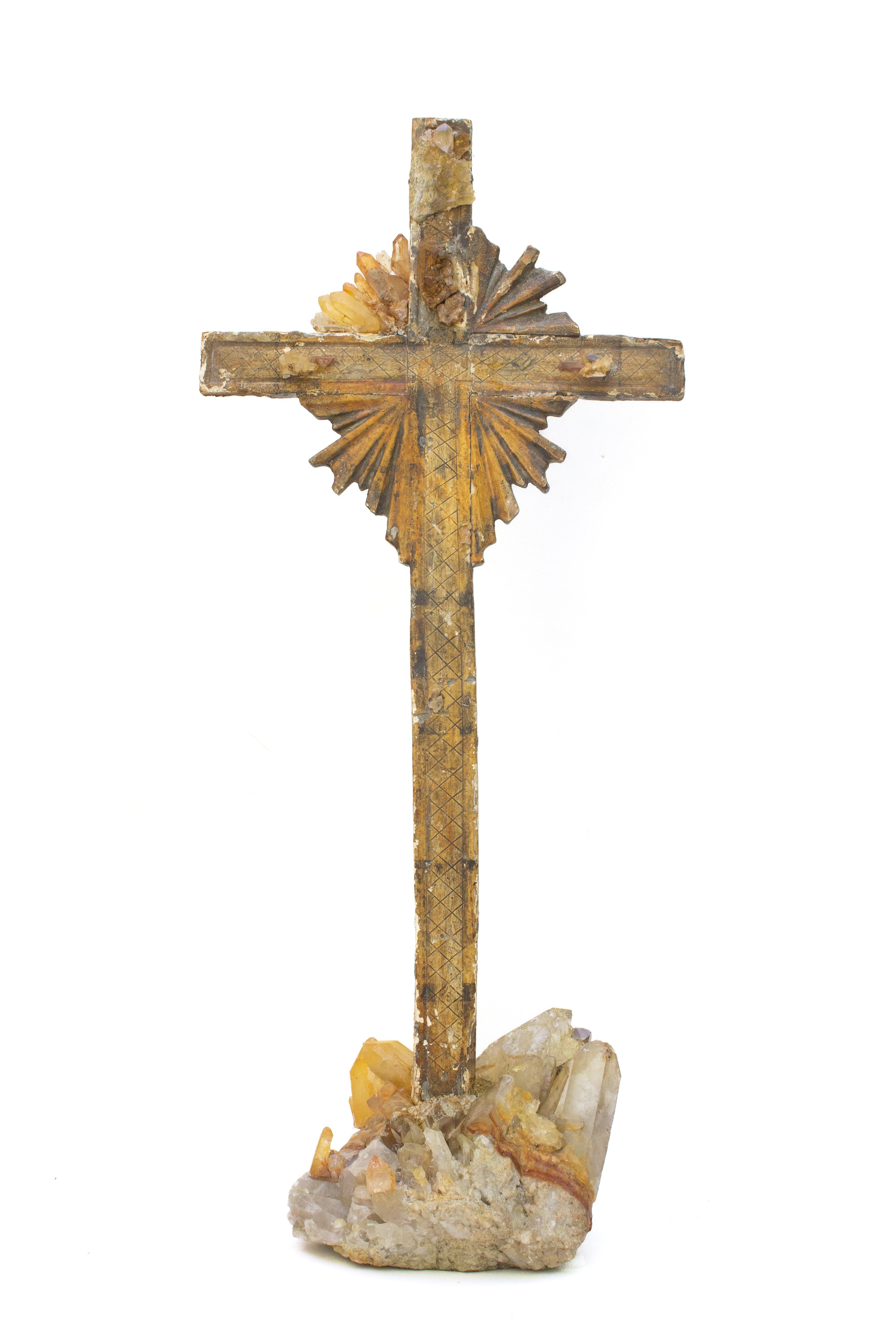 18th century Italian cross adorned with tangerine quartz crystals on a tangerine quartz and crystal cluster base. The crucifix originally came from a church in Tuscany. The crystal quartz points replicate the original sunrays or halo around the