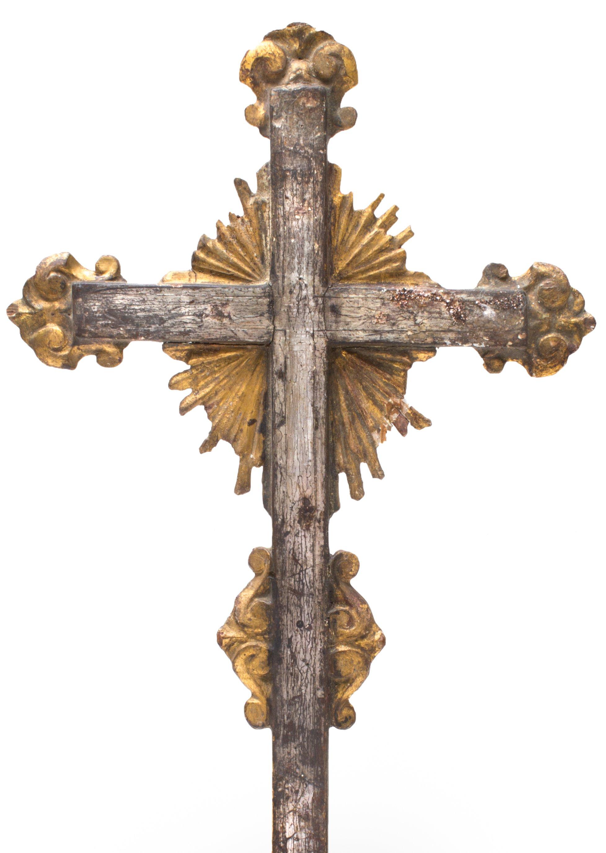 18th century Italian crucifix on a tourmaline base with mica inclusions and silver plated kyanite. The magnificent silver leaf crucifix is outlined with gold leaf sunrays. It has elaborate details because it comes from important church in the