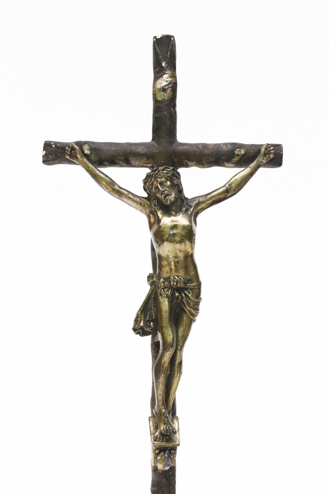 18th century Italian crucifix with gold-plated rock crystals. The crucifix came from a church in Liguria. The base of the crucifix coordinates with the bronze figure of Christ. The overall piece is accented with gold plated rock crystals.