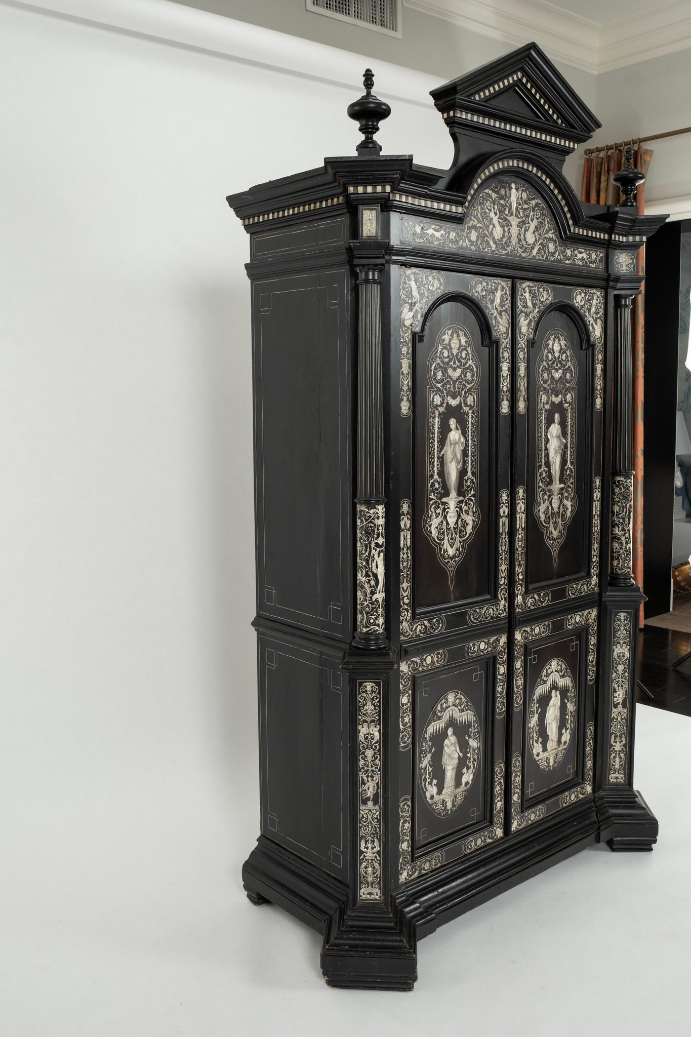 A glorious and magnificent 18th Century Italian collectors cabinet architecturally styled with pediment, columns and finials. This extremely fine cabinet features Florentine inlay detail decorated overall with the 