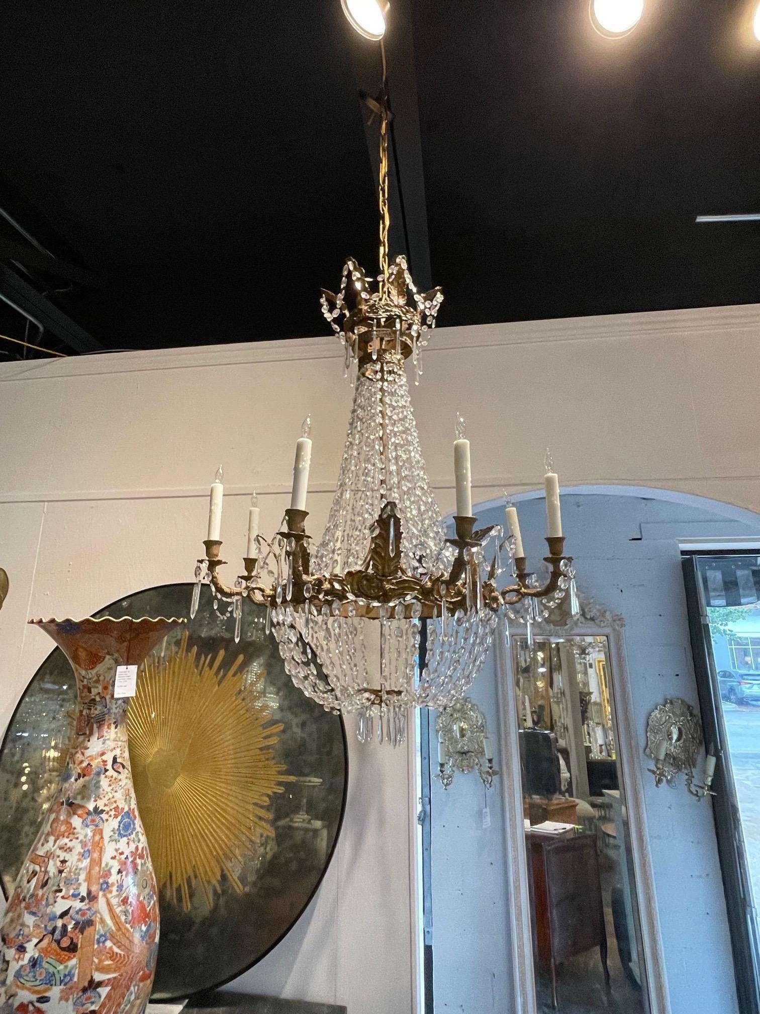 Very fine large 18th century Italian Empire style crystal and gilt tole basket chandelier. This fixture has 8 lights and is covered in shimmering crystals. So elegant!!