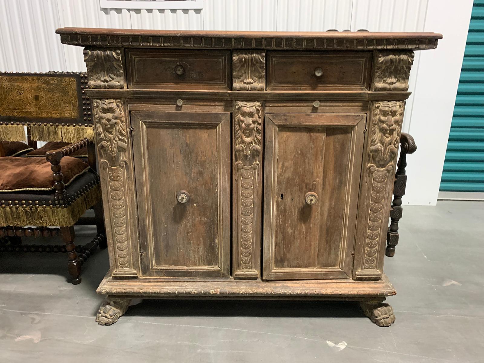 18th century Italian finely-carved credenza, two drawers, two slides two doors
two shelves on the inside.