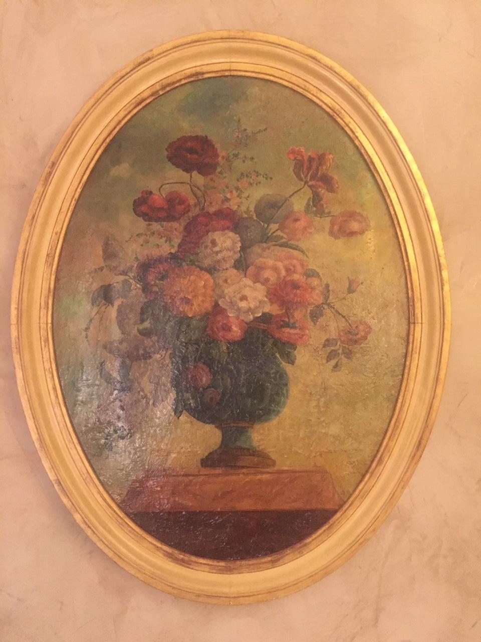 Beautiful 18th century Italian floral oil on canvas. Golden oval frame.