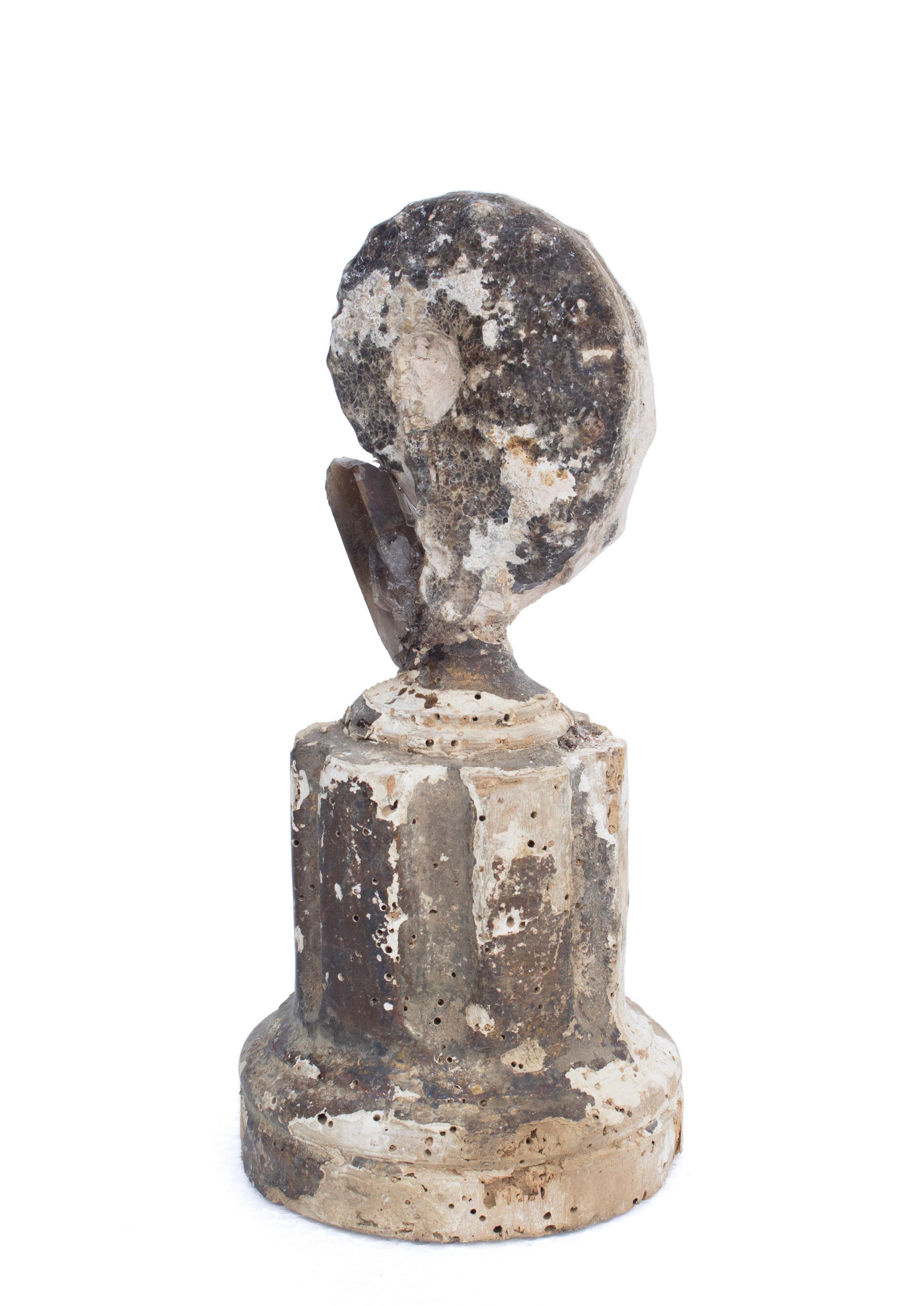 18th century candlestick base from Tuscany mounted with a coordinating ammonite and dark, smoky quartz crystal point. This fragment is from a church in Florence. It was found and saved from the historic flooding of the Arno River in 1966.

The piece