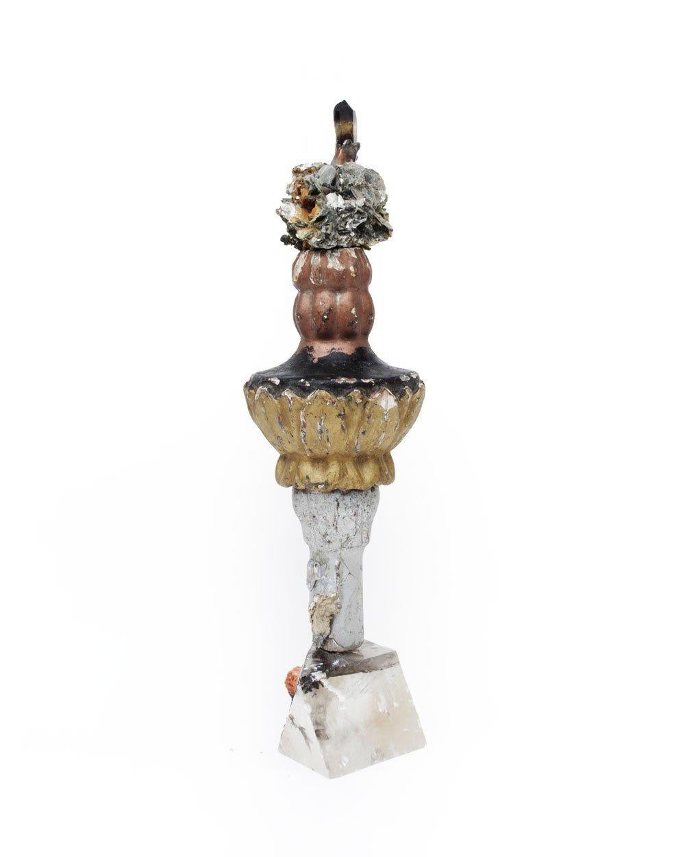 18th century Italian painted fragment decorated with mica in matrix and a Smokey lemon quartz crystal on a phantom optical calcite base.

The 18th century fragment is hand carved and painted and originally came from a church in Venice. It is put