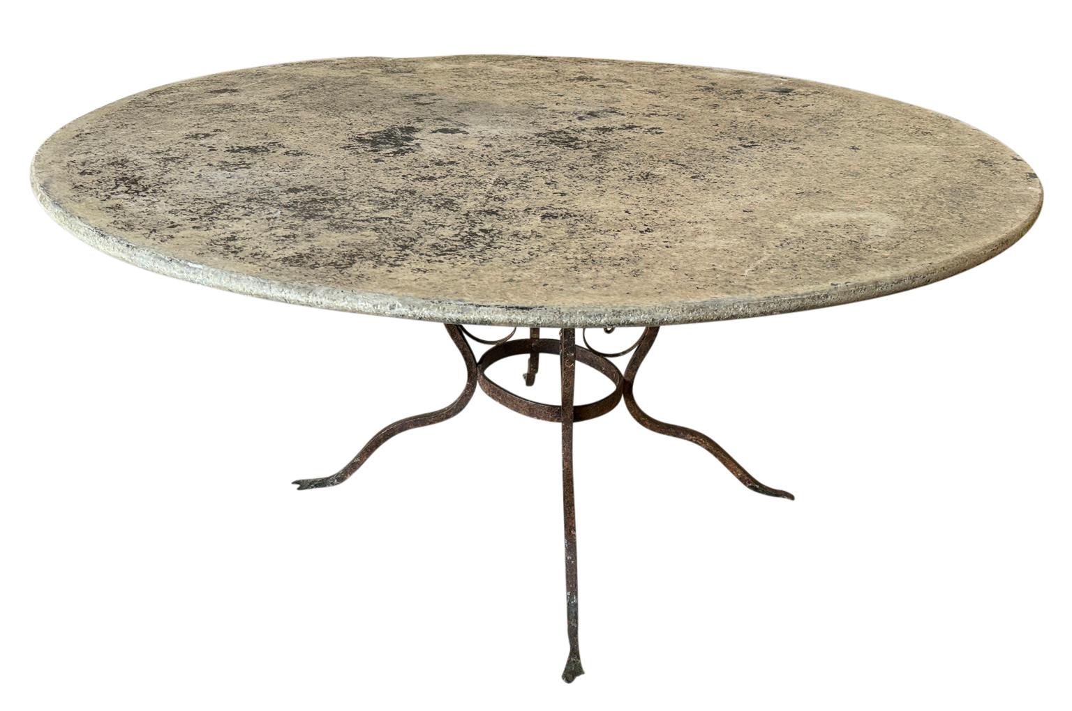 An outstanding 18th century Garden Dining Table from the Genoa region of Italy.  Beautifully constructed with a hand forged base and a thick slate top.  Fabulous patina.  Perfect for any interior or garden.