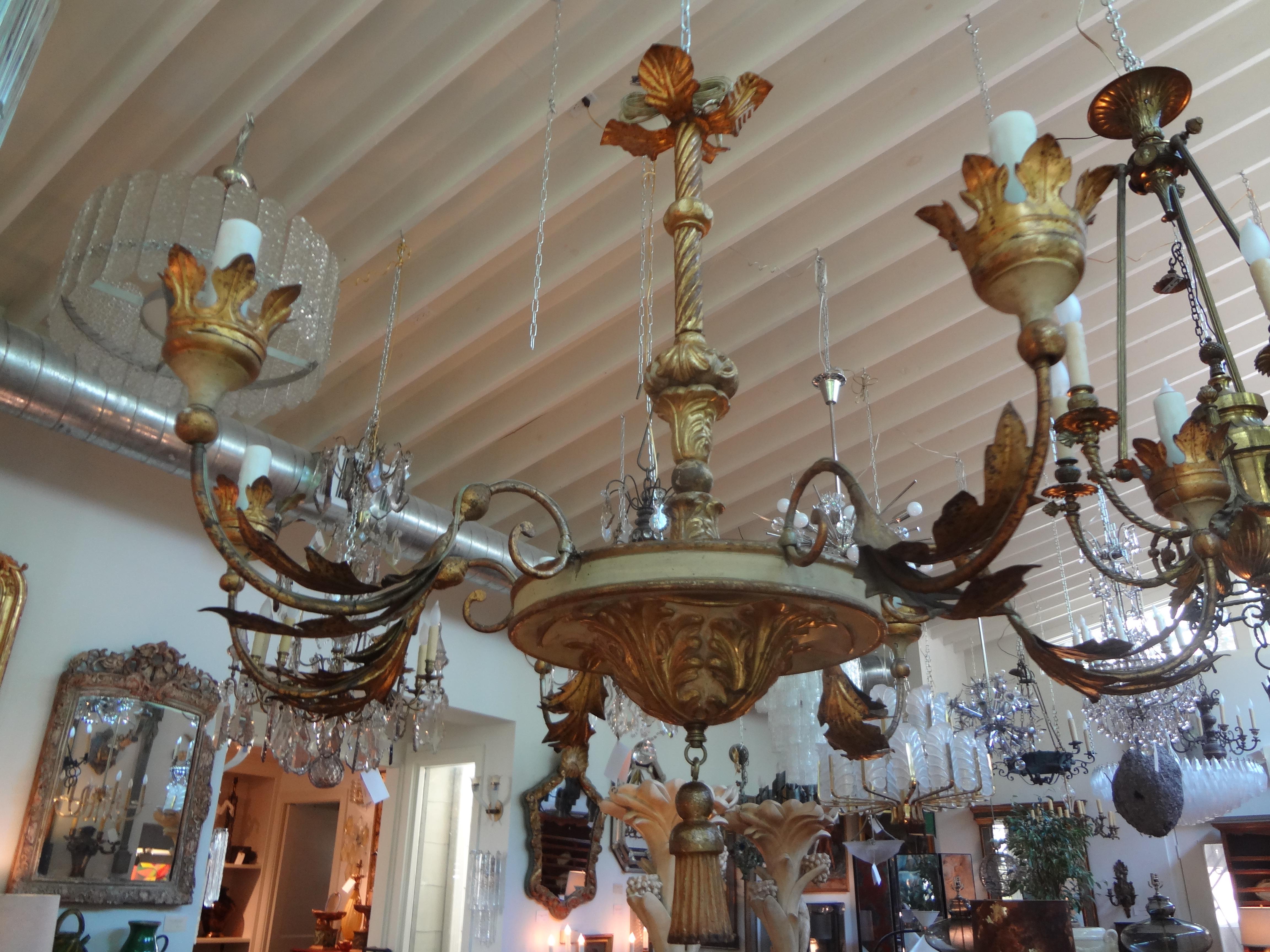Stunning large 18th century Italian Genovese six-light painted and giltwood chandelier. This elegant Northern Italian giltwood chandelier has six elegantly forged iron arms and has been newly electrified. This lovely versatile chandelier would work