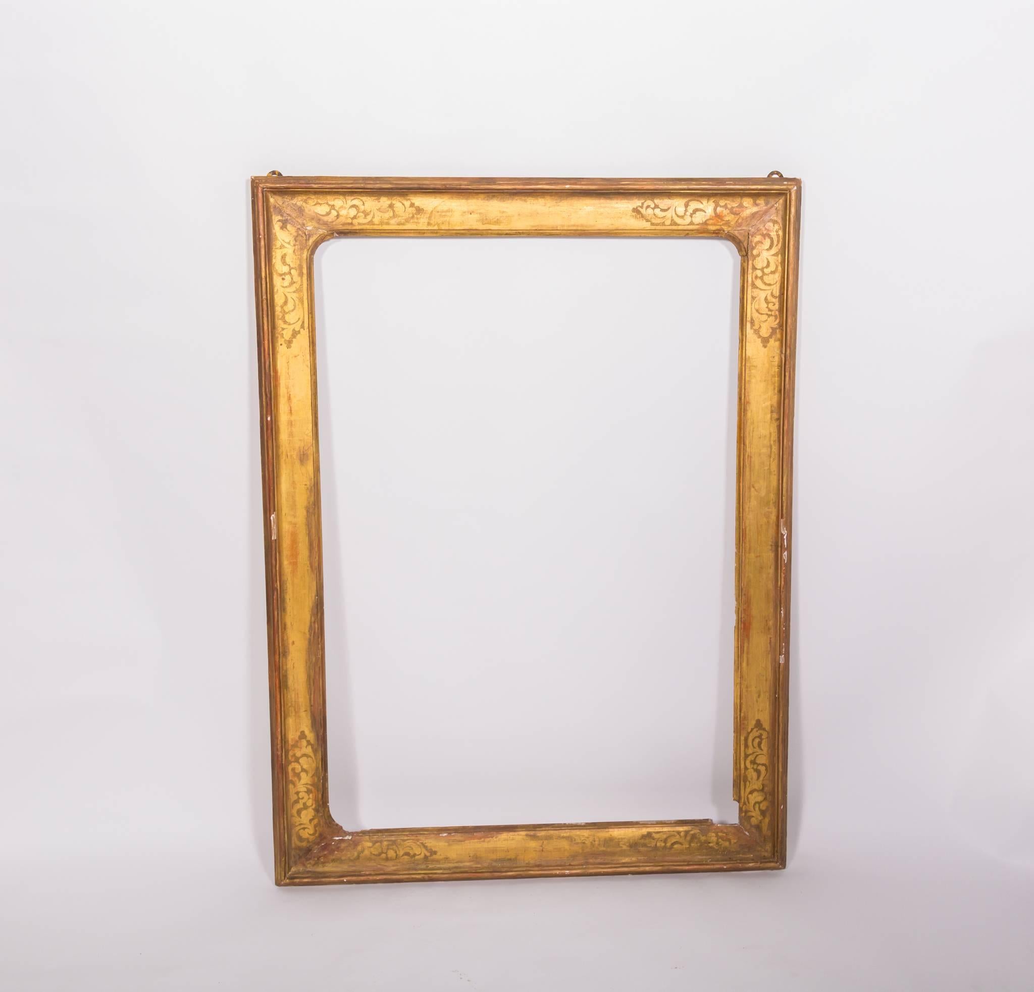 Beautifully etched wooden frame from Florence with original gilding.