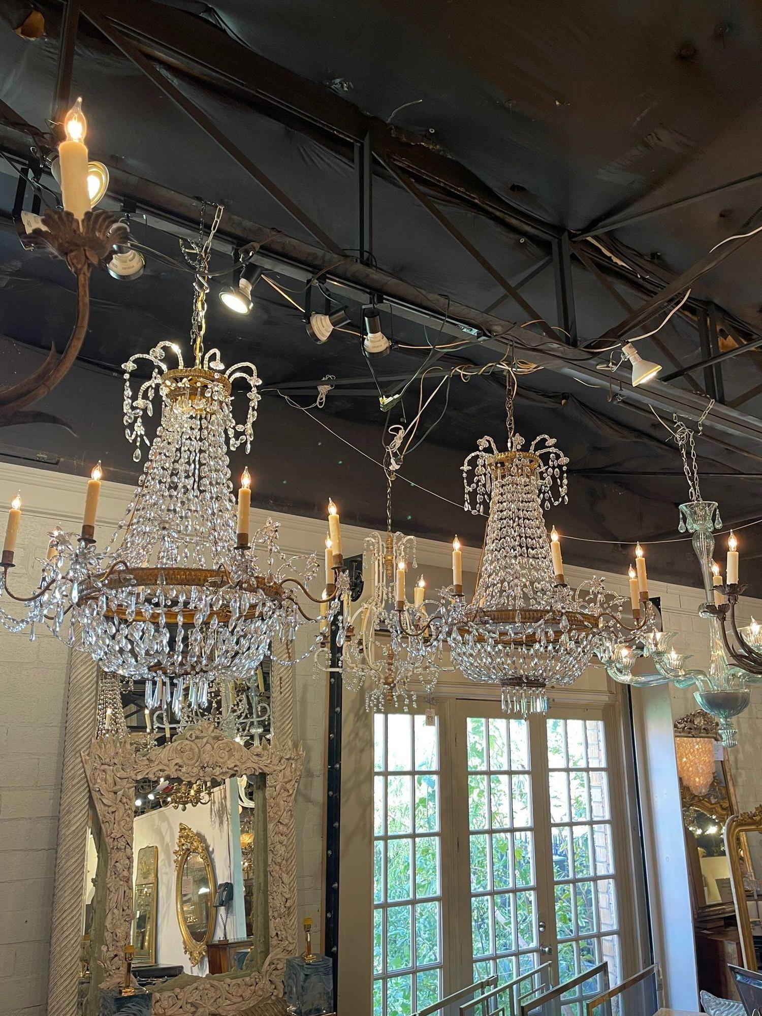 Exceptional 18th century Italian gilt brass and crystal chandeliers. Featuring glistening crystals on a beautiful brass base.  These are sure to impress!  Note:  Sold each