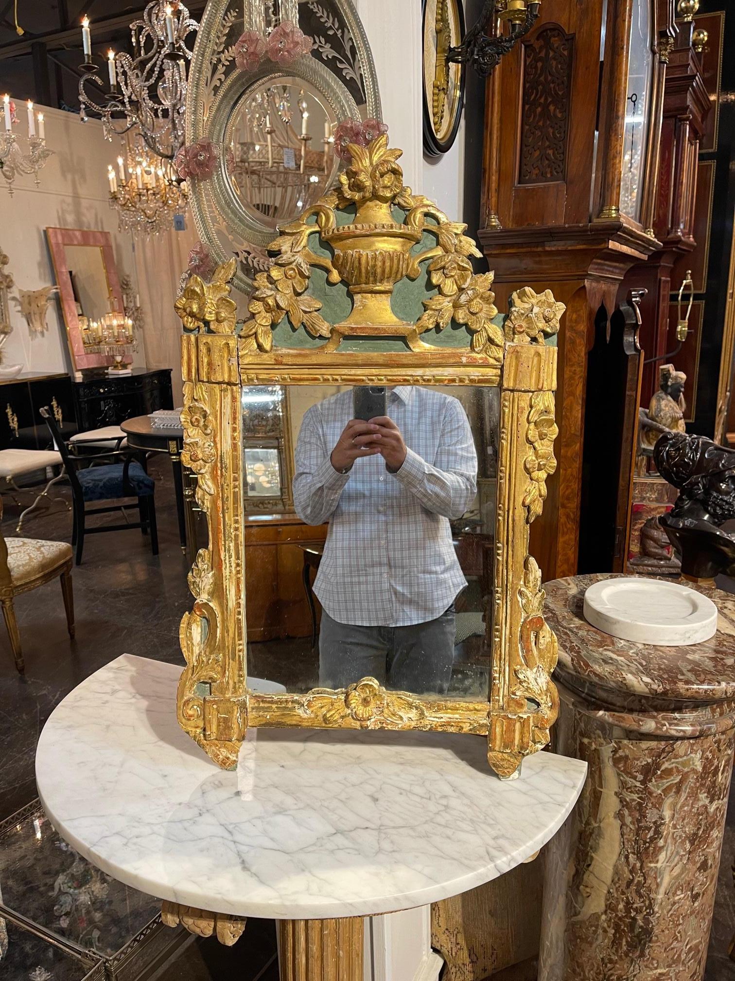 18th Century Italian carved and parcel gilt mirror. Circa 1780. This is a nicely carved mirror that is sure to make a statement.
