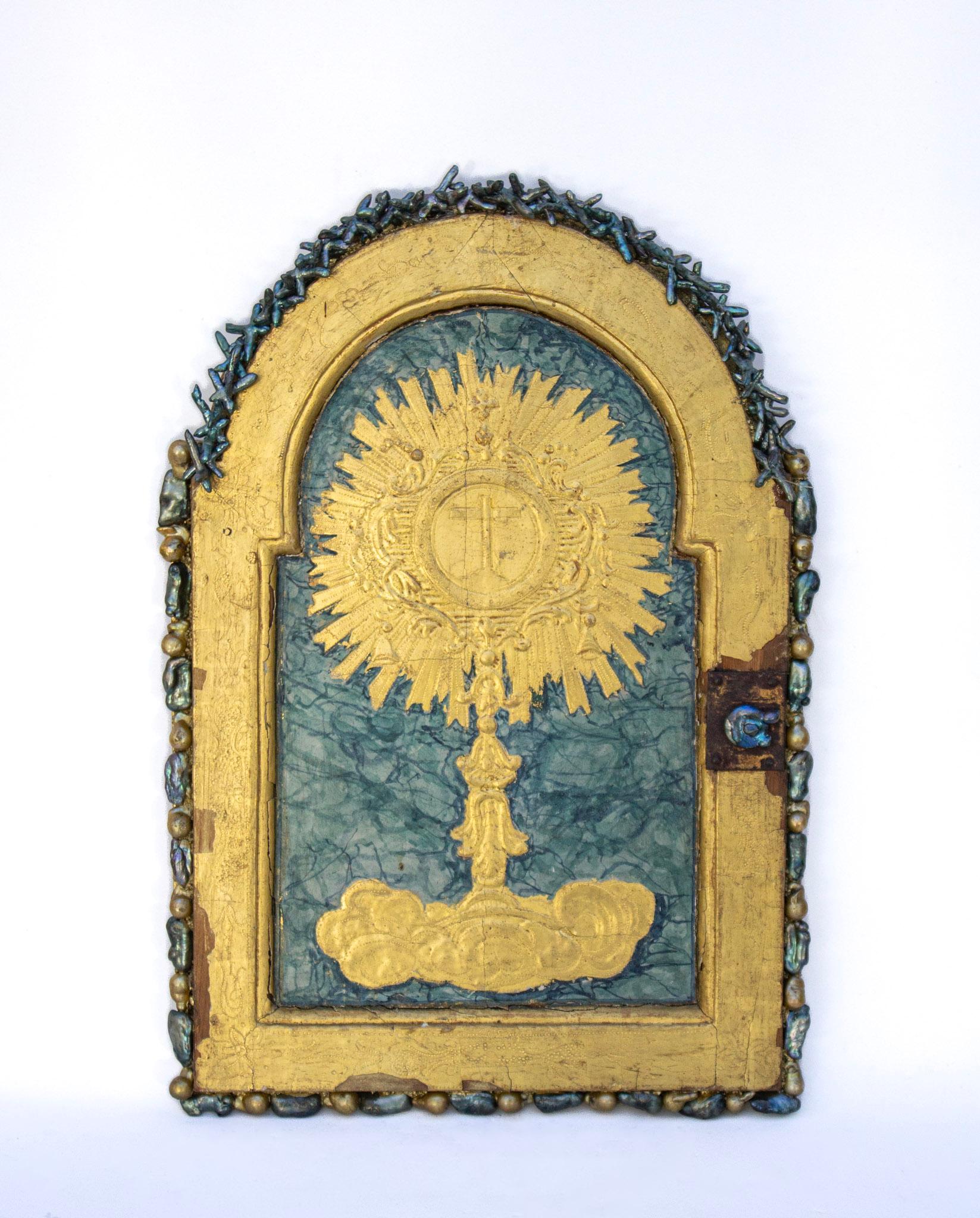 18th century Italian gold gilded tabernacle door adorned with naturally forming baroque pearls. This door once belonged on a tabernacle which housed the eucharist in a church. In the center of the door is a depiction of a chalice with an impressed