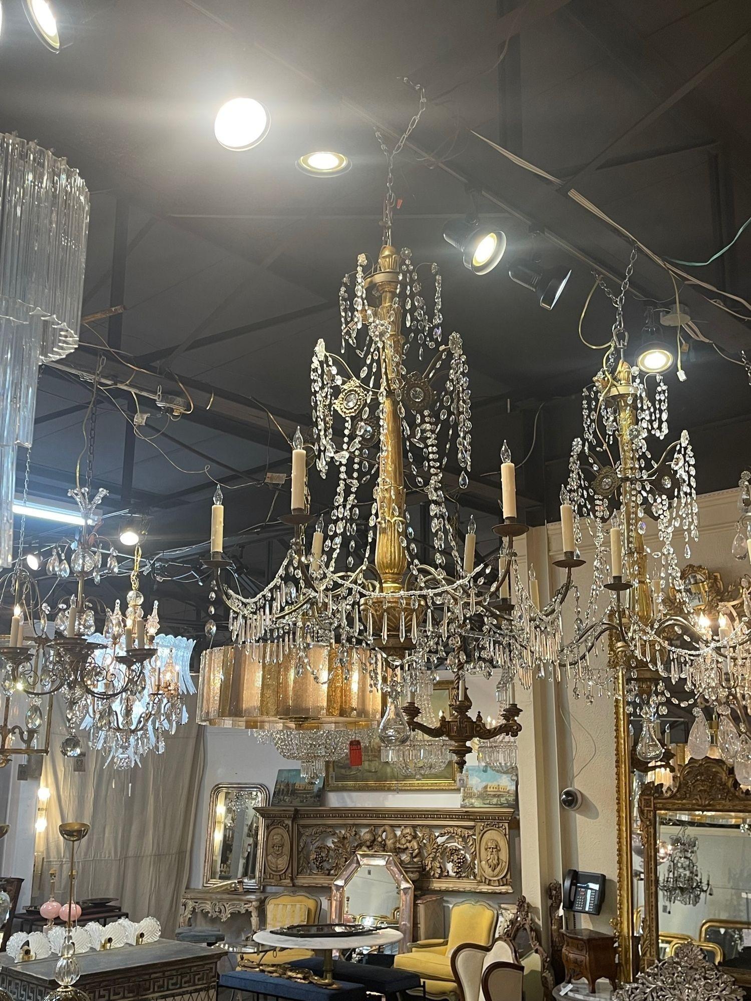 Lovely 18th century Italian giltwood chandeliers from Genoa. These are very elegant with a beautifully carved base and draping crystals. Creates a light and airy feel. So pretty!