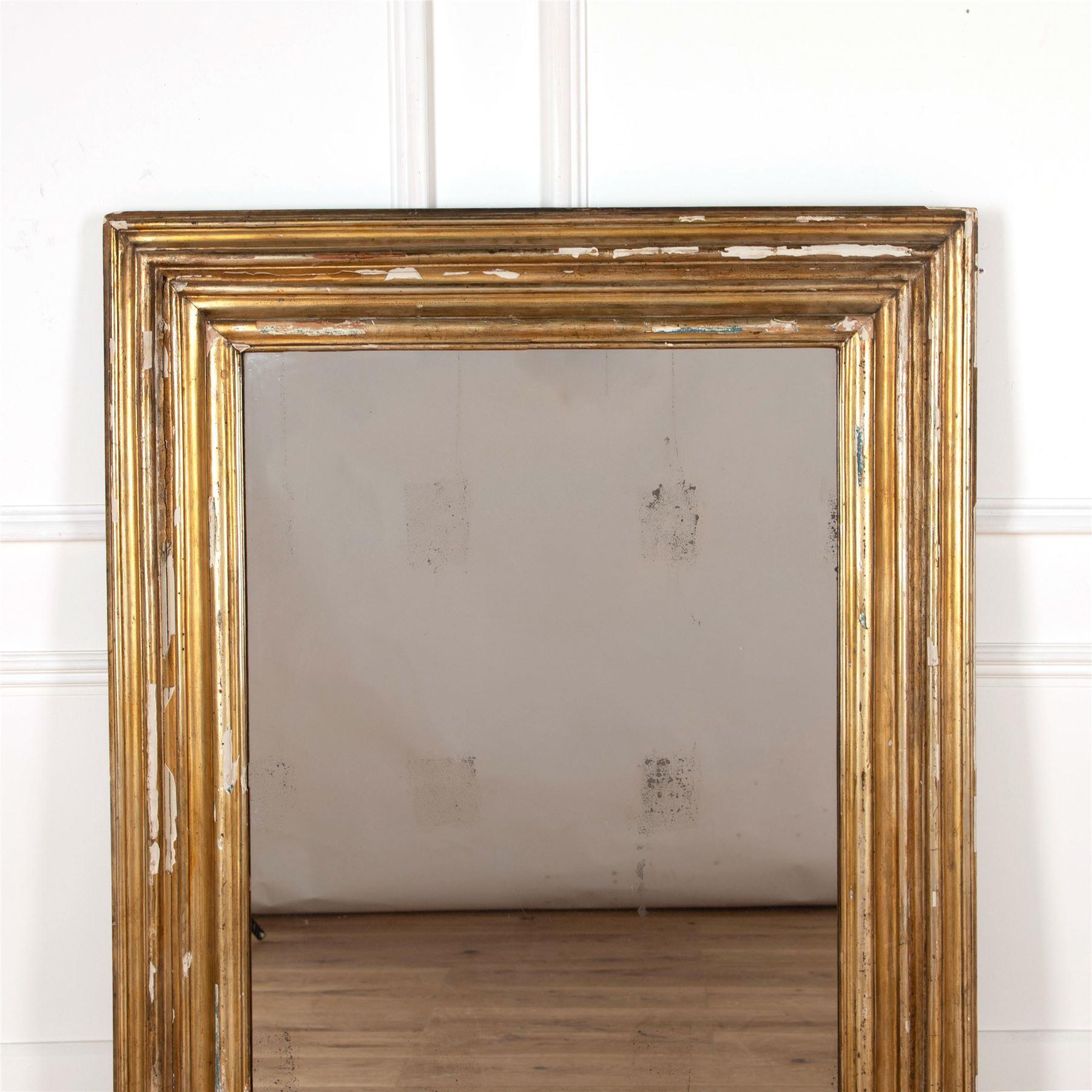 Wonderful 18th century Italian giltwood frame fitted with antique mercury glass mirror plate.