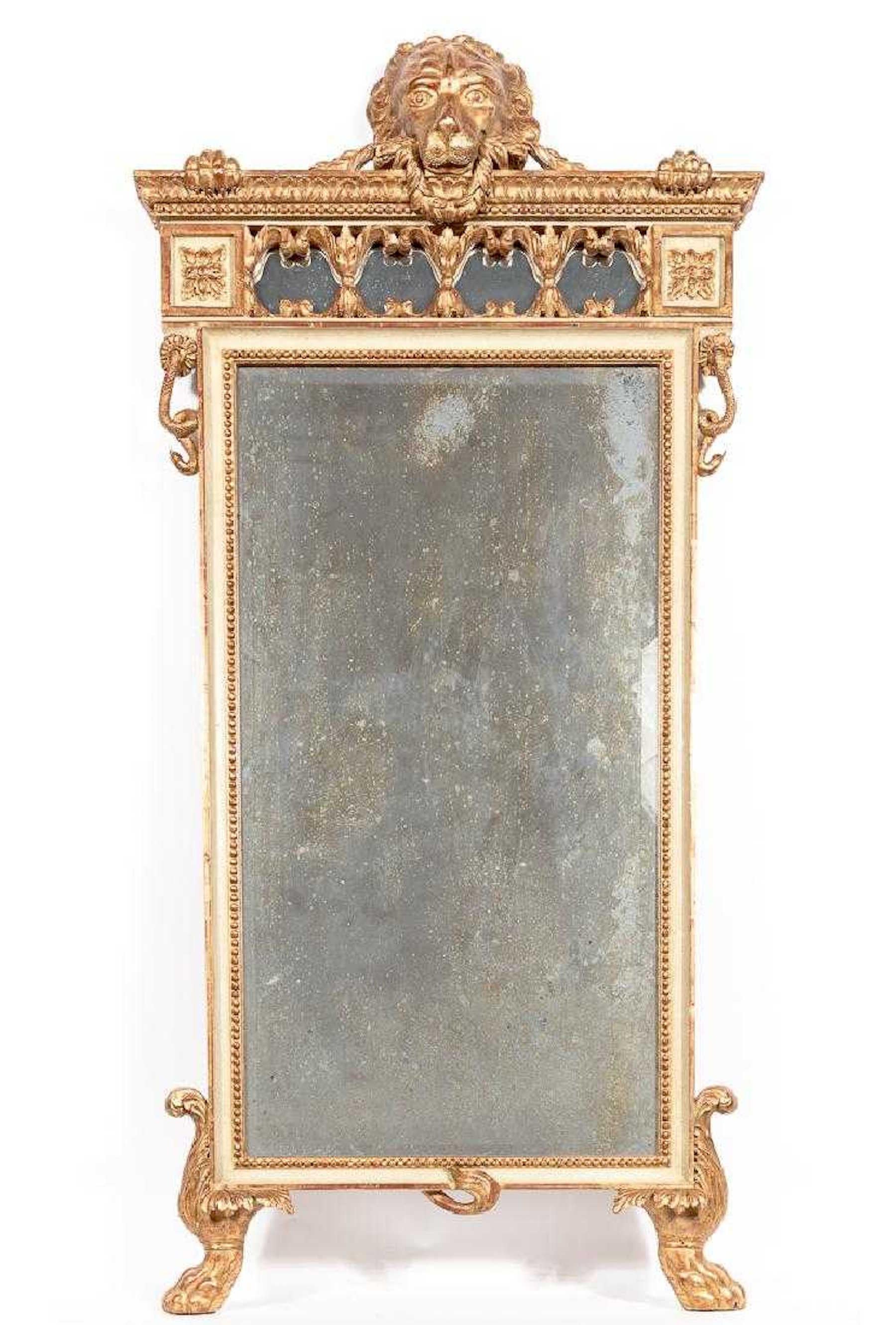 18th century Italian giltwood neoclassic standing lion motif mirror, whimsically designed with a standing lion appearing to hold the water giltwood and parcel gilt frame holding the antique beveled mirror plate.