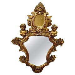 Espejo de pared italiano de madera dorada del siglo XVIII