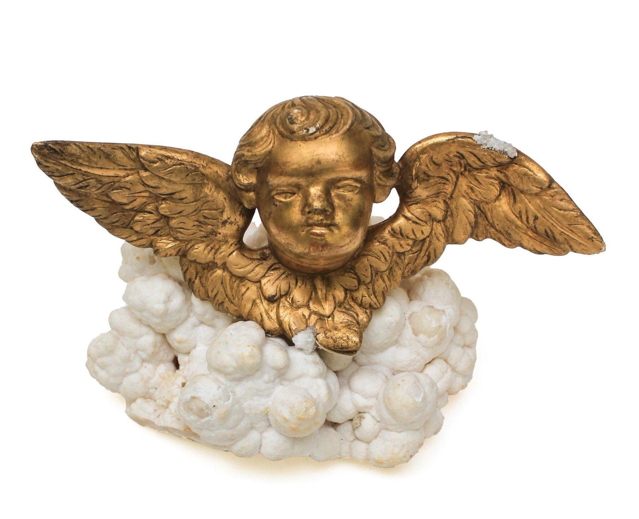 18th Century Italian gold leaf putto mounted on aragonite. A Putto is a cherub figure frequently appearing in both mythological and religious paintings and sculpture, especially of the Renaissance and Baroque periods. 

This was once used as part