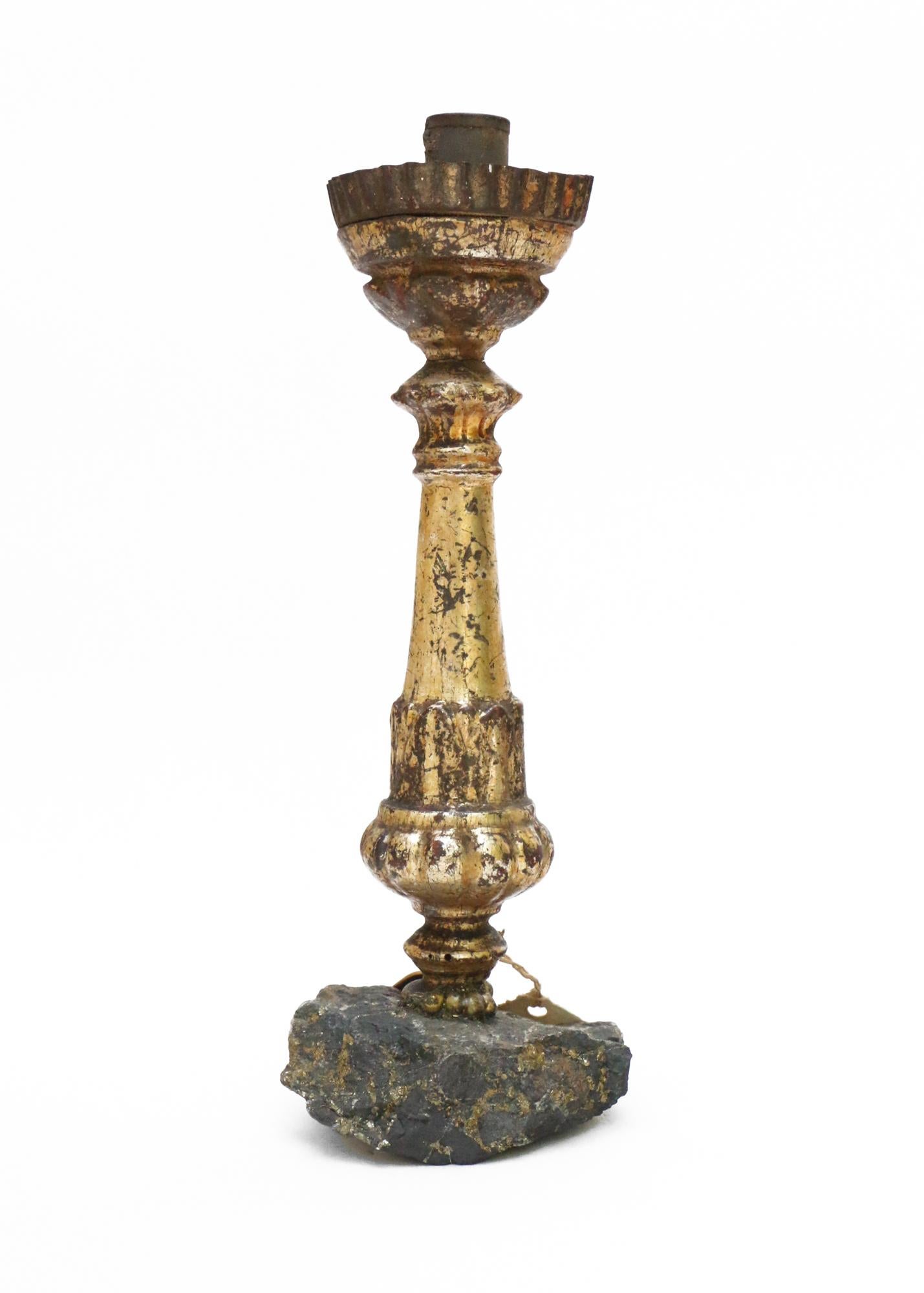 Sculptural 18th century Italian candlestick mounted on chalcopyrite and adorned with baroque pearls.

This fragment was originally part of a candlestick from a historical church in Italy. It is distressed from time but still has the original gold