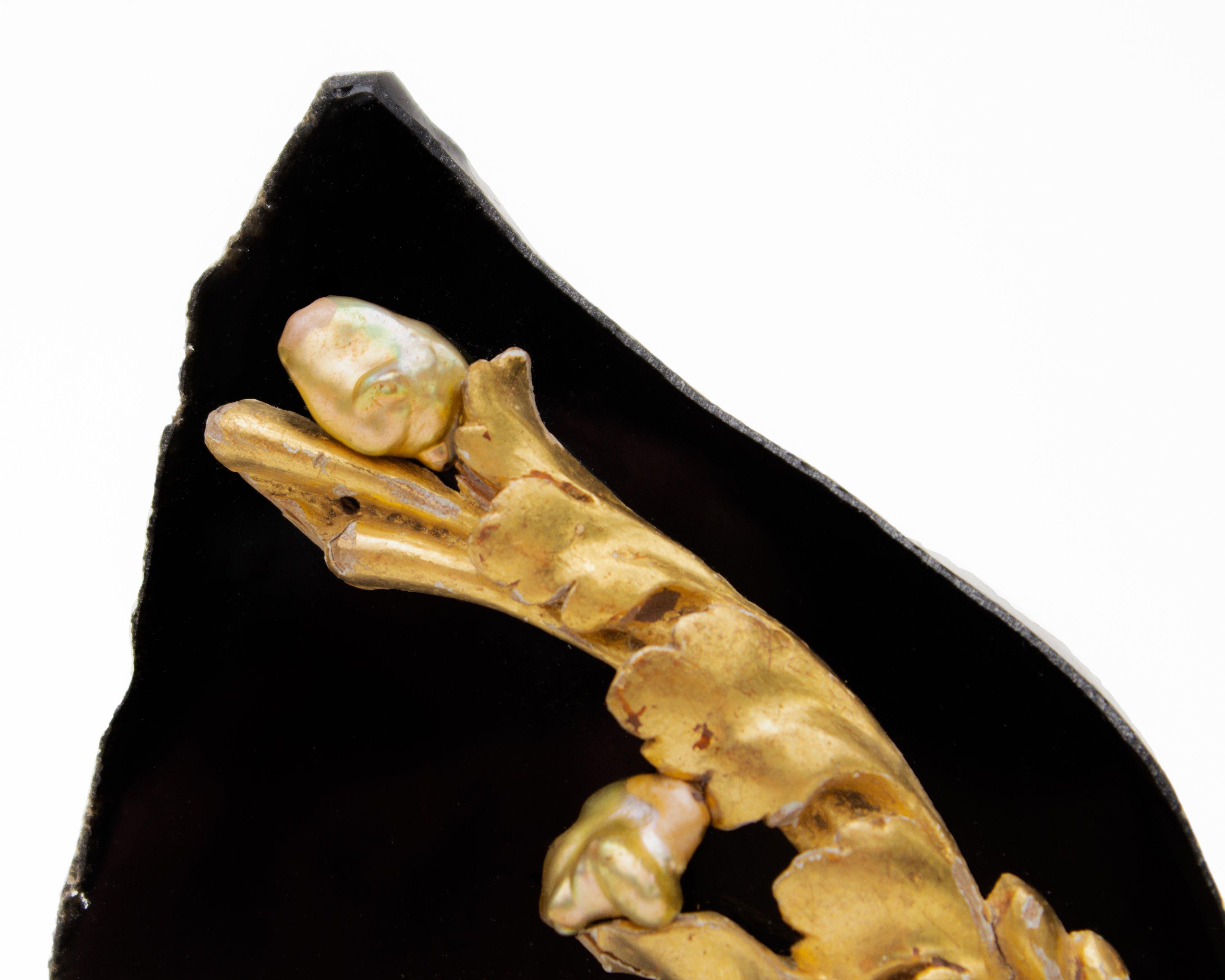 18th century Italian gold leaf fragment decorated with coordinating Baroque pearls on a free-forming obsidian mineral with a polished face. Obsidian is naturally occurring volcanic glass produced when lava flowing from a volcano cools rapidly with