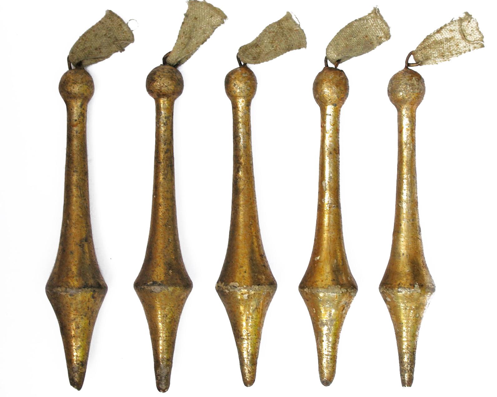 Rare 18th century Italian gold leaf tassel ornaments - 3 sets of five of the pointed tassels, 2 sets of the spiral carved tassels, one set of the tear drop tassels, and one set of the large pointed tassels. 7 sets altogether so 35 tassels. 

These