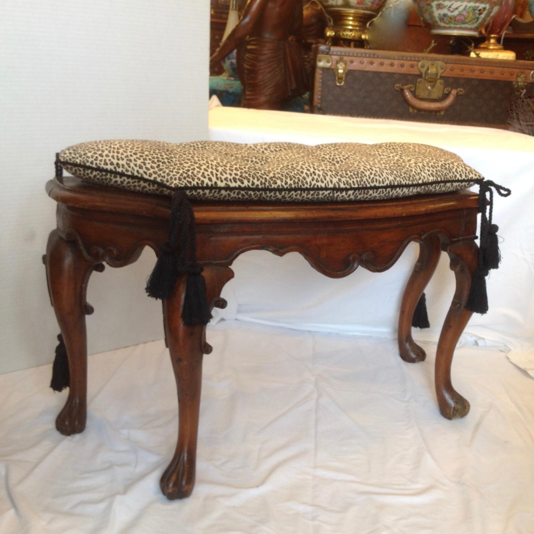 Beautifully carved in walnut and topped with a loose faux leopard cushion above the caned seat - superb style, scale and quality.
