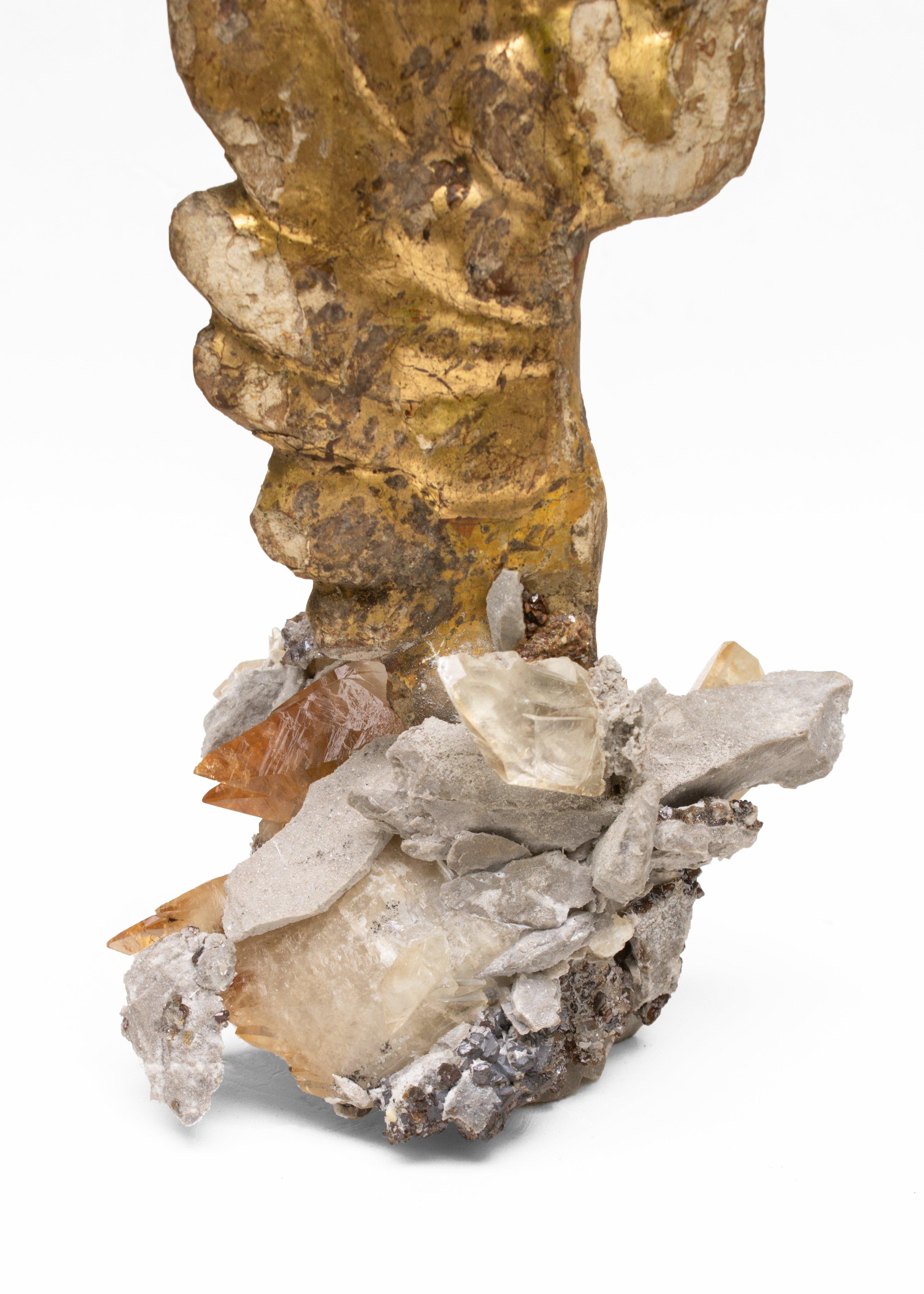 18th century Italian hand carved angel wing on calcite crystals in a matrix of sphalerite.

The hand carved gold leaf angel wing is originally from a church in Tuscany. The ecclesiastical artifact is adorned with calcite crystals in a matrix of