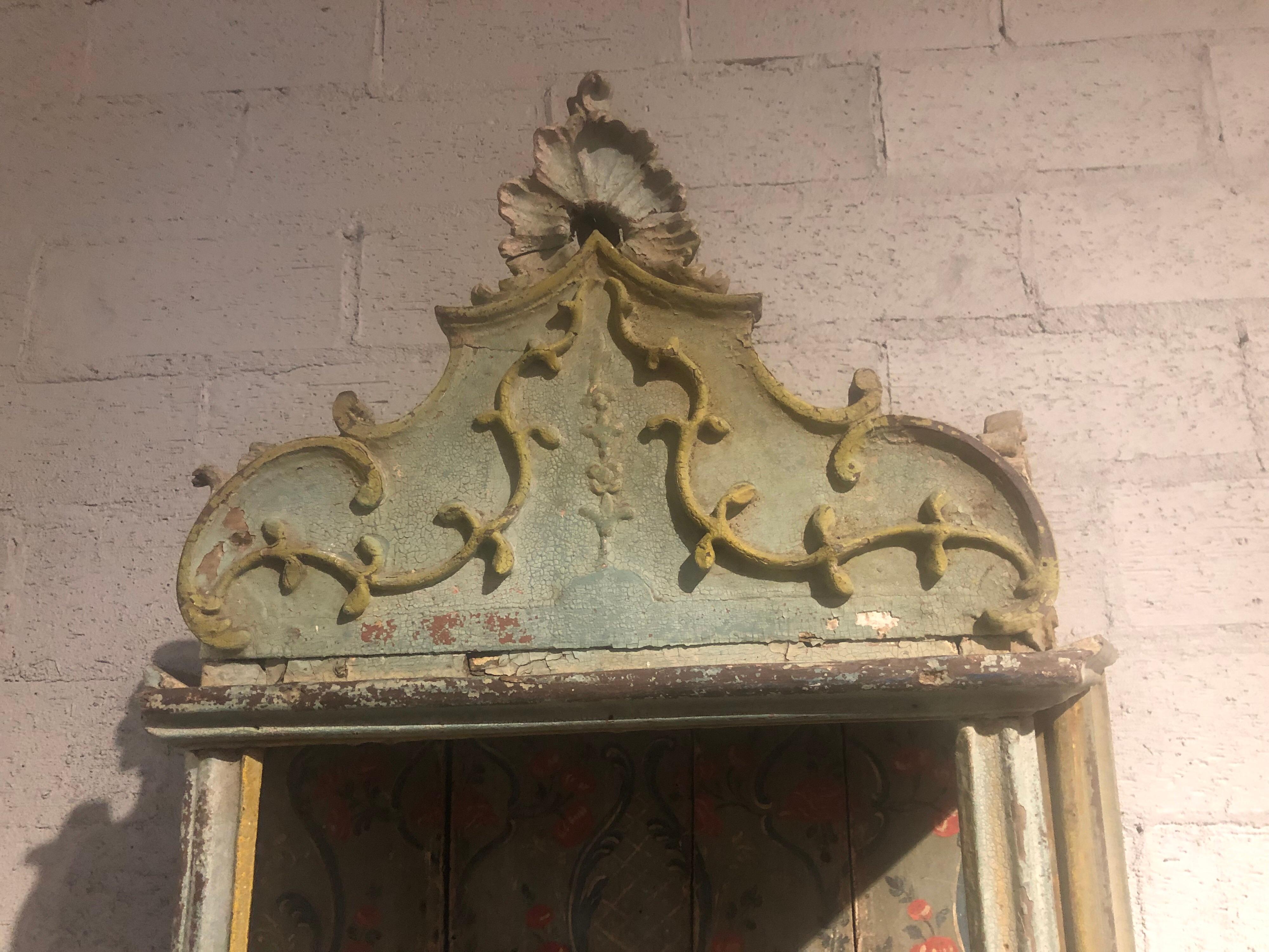 Beautiful 18th century Italian carved and hand painted wall shelf. Painted with a design of leaves, flowers and scrolls. A very unique piece!
