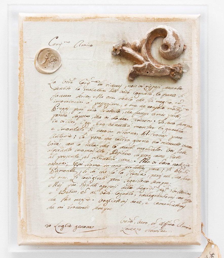 18th century Italian handwritten letter decorated with a fragment and coordinating crystals on a Lucite back.

The 18th century handwritten letter was found as part of a group of letters from Italy. It has been mounted as a wall piece with a