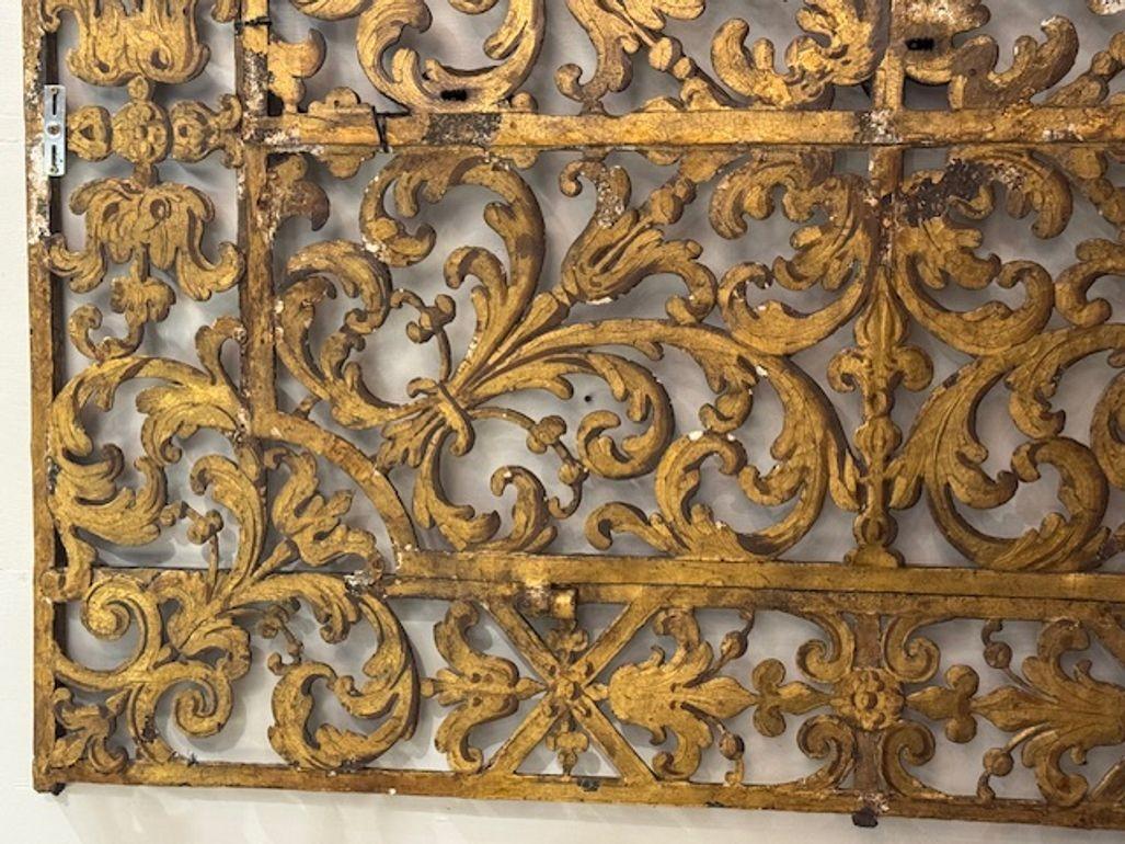This product is an 18th-century Italian heavy gilded iron gate, showcasing a classic Italian style with intricate detailing. Made from durable iron, this gate is not only functional but also serves as a decorative piece, adding a touch of elegance