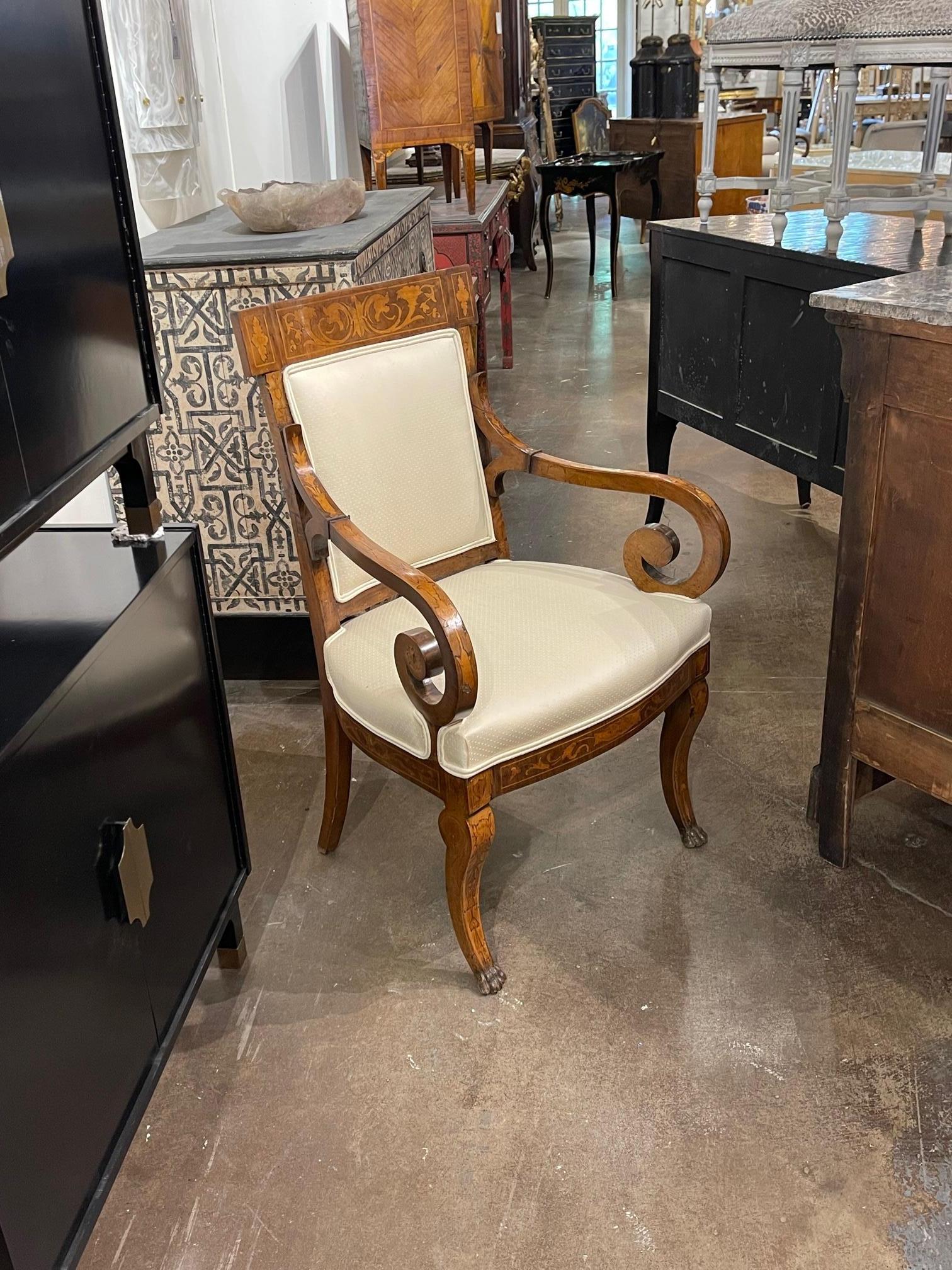 Elegant late 18th century Italian armchair made of walnut and upholstered in a creme colored fabric. There is a beautiful inlaid pattern in the wood. An exceptional piece!!
