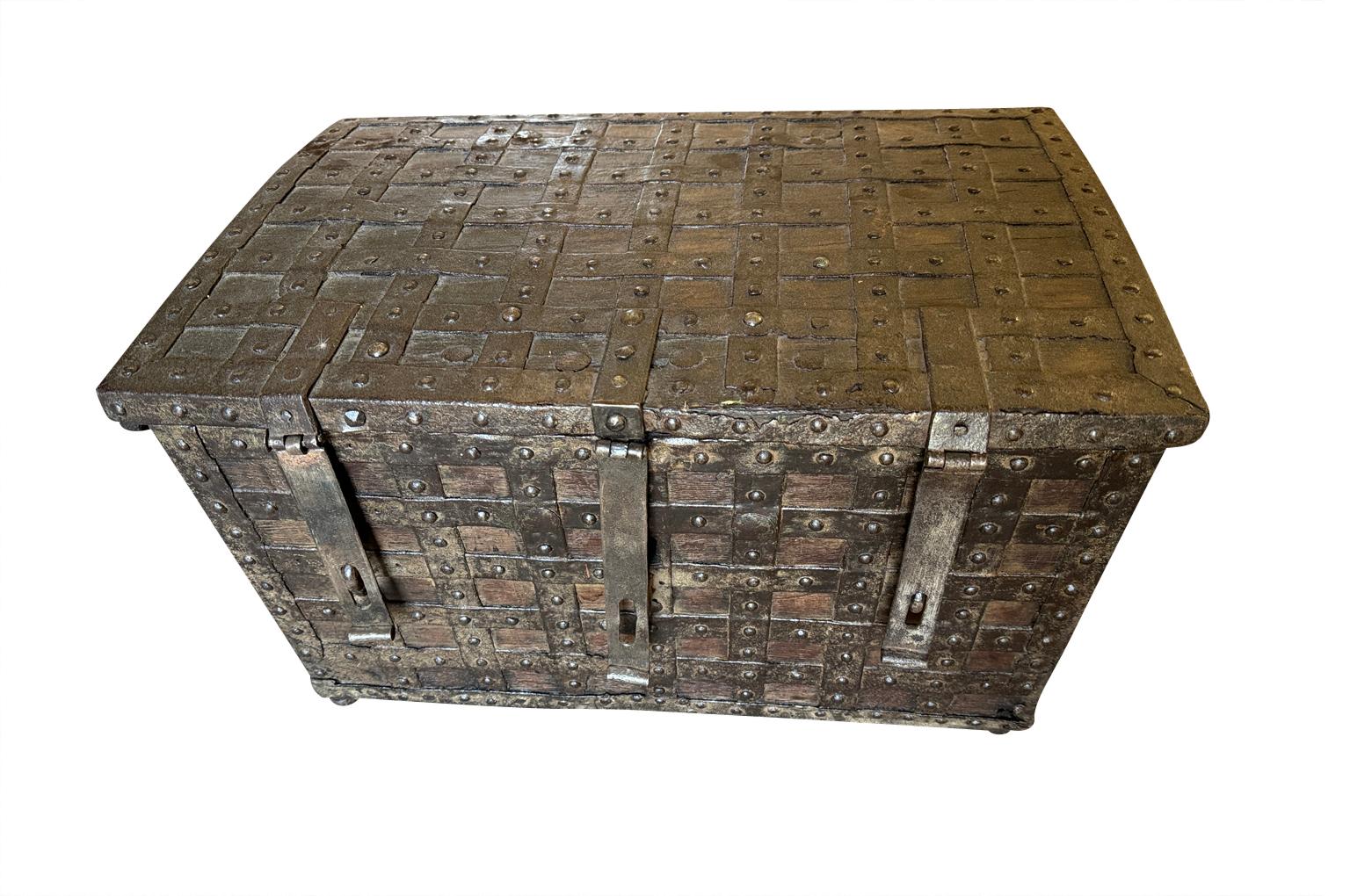 A very striking 18th century Coffre Forte - Safe - from Northern Italy.  Masterly crafted from iron and wood.  Wonderful patina and storage.  A fabulous piece to serve as a coffee table or end table.