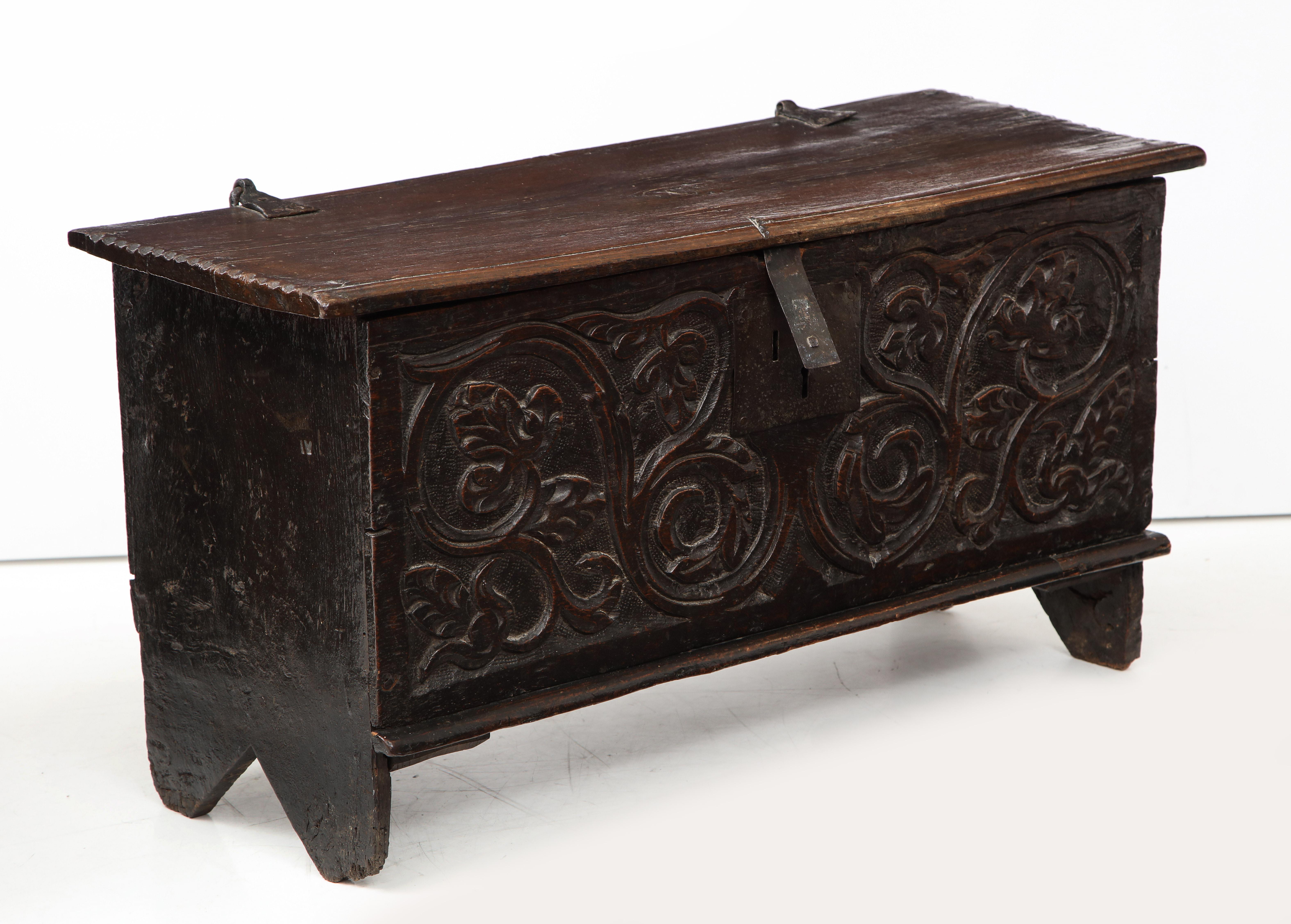 Handsome deeply carved coffer / trunk depicting a Jacobean theme of vines and floral elements. Aged wax finish gives this piece a terrific patina. 