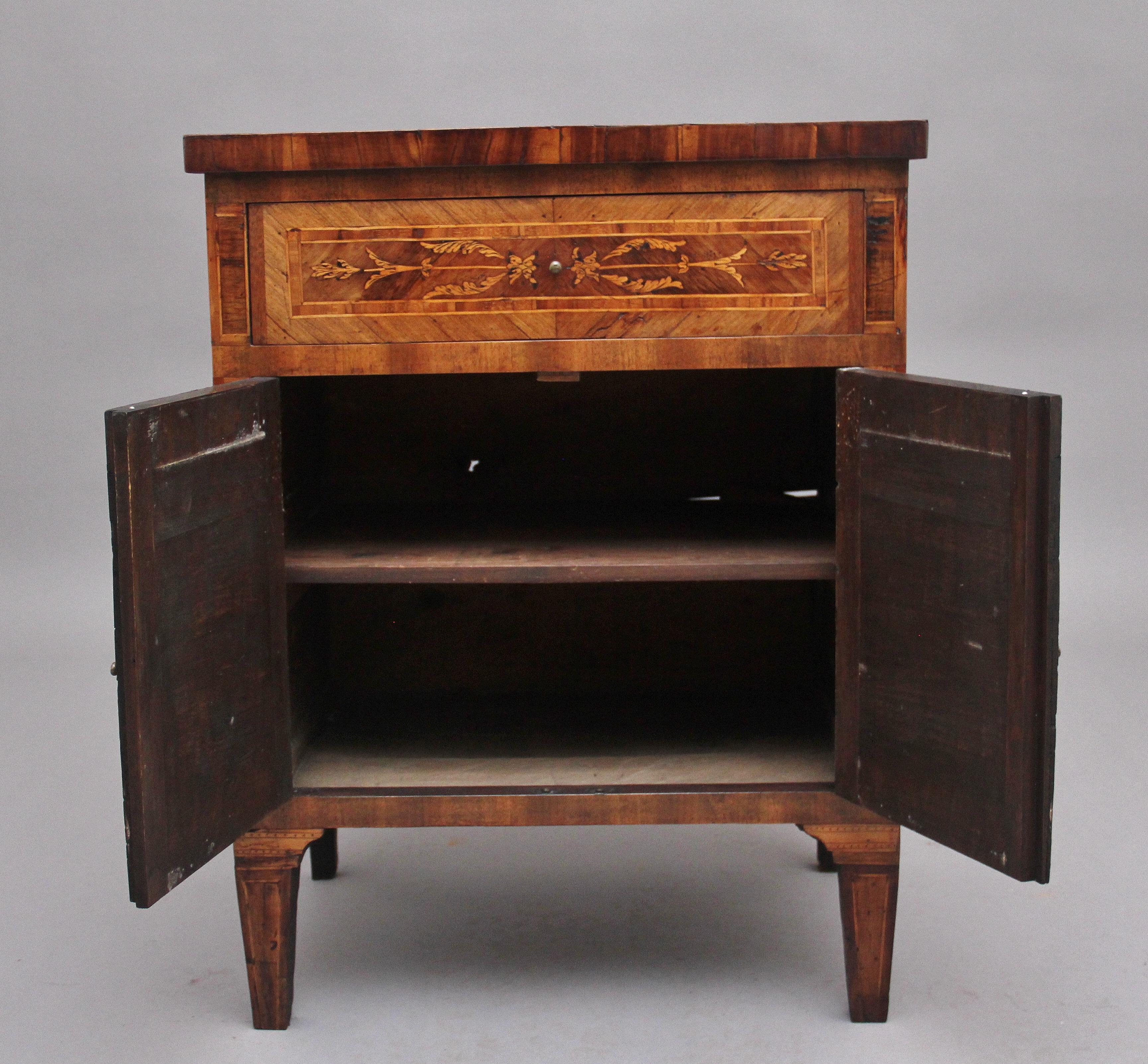 18th century Italian inlaid cabinet made from Kingwood and other exotic woods, the inlaid top above a frieze drawer and a two door cupboard below with a fixed single shelf inside, the drawer and door fronts having wonderful decorative marquetry
