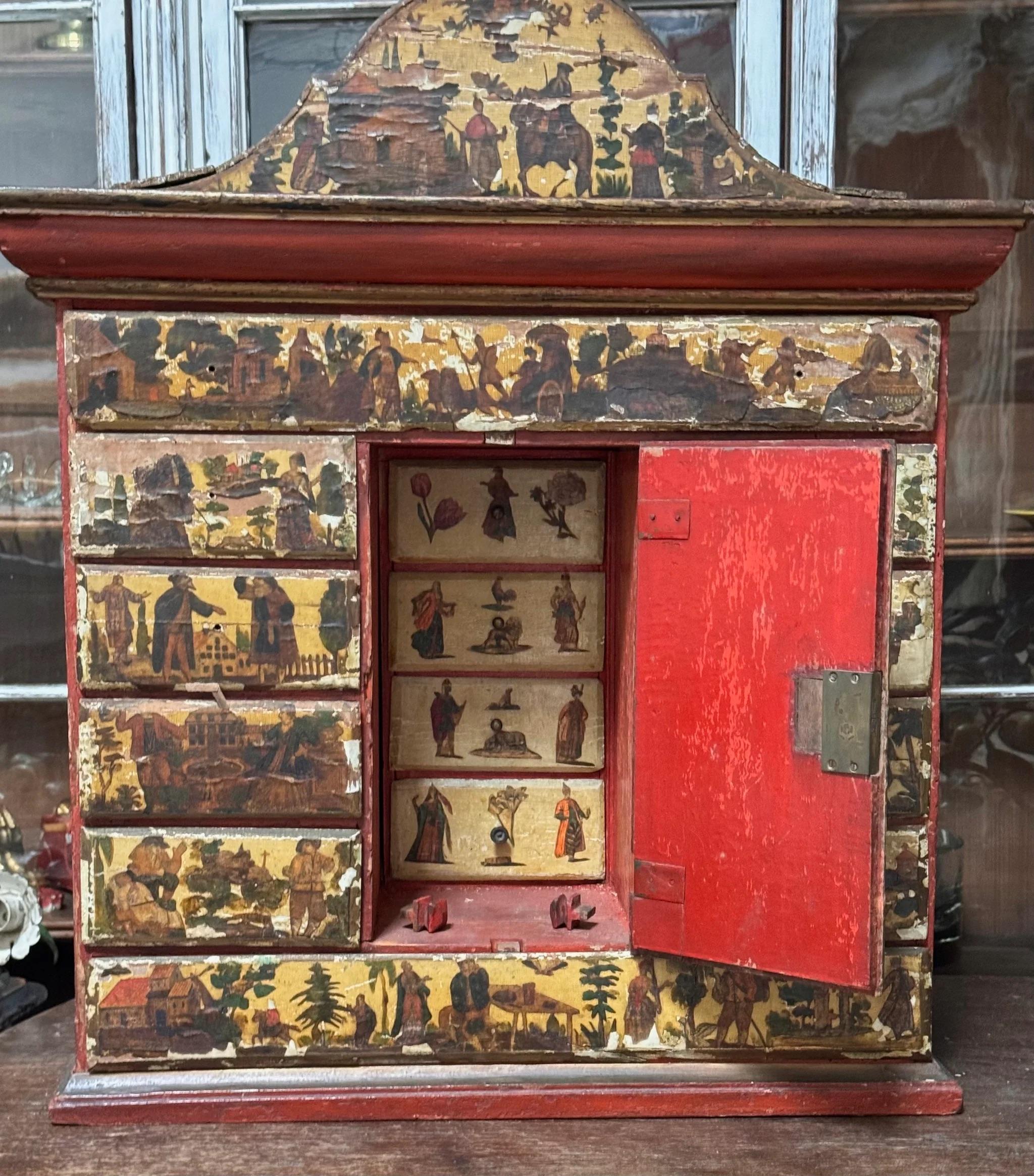 Rare 18th Century Venetian  Lacca Povera Valuables Table Top Cabinet  - having two long drawers to the top and bottom of the cabinet, between which are eight short drawers flanking a central door behind which are four more secret drawers.  Lock