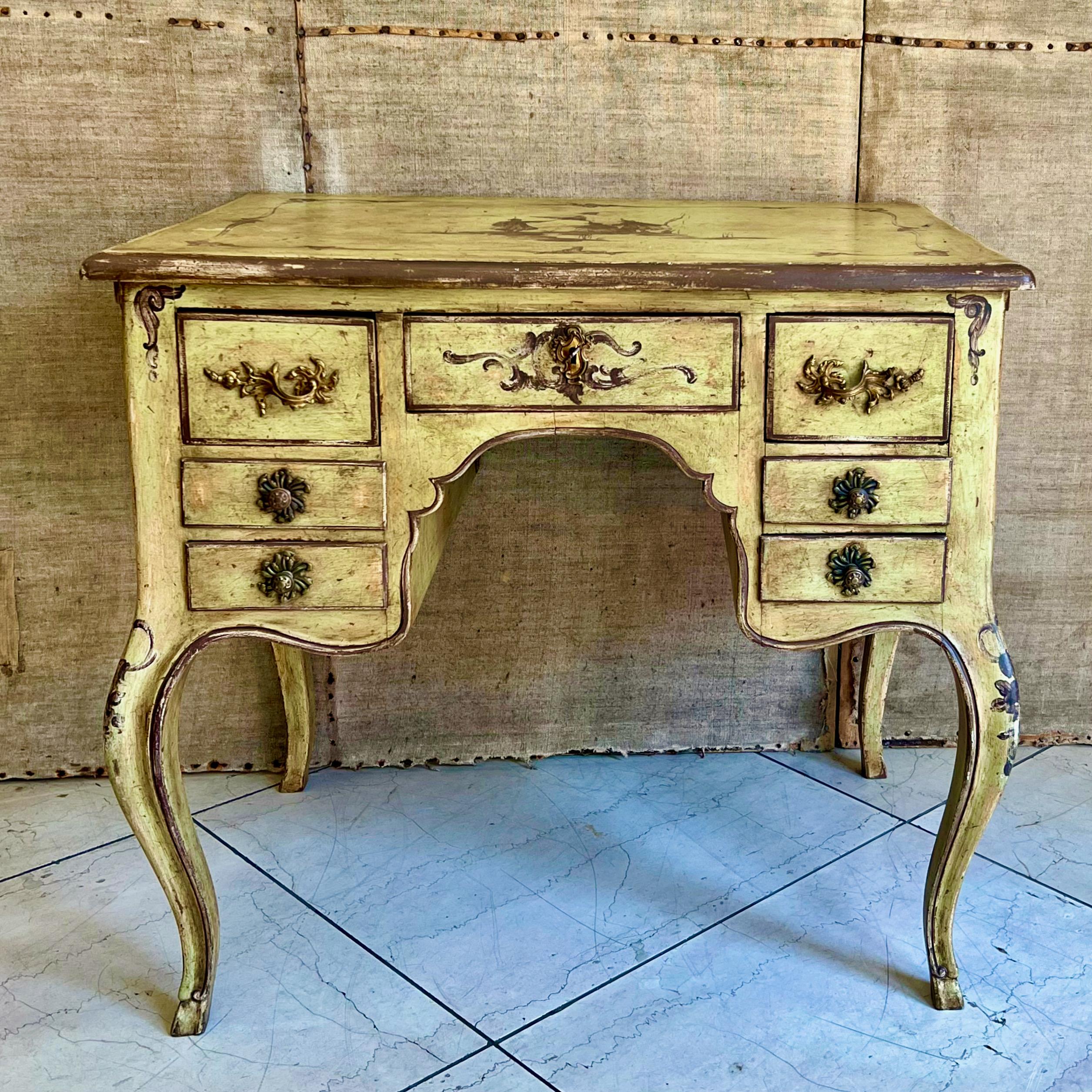 Charming and rare 18th C. Italian painted small ladies desk having deep yellow, maroon and and gold/ochre scrolling foliate in chinoiserie motifs with similar painted detail to both sides, raised on delicate slender cabriole legs. Original condition