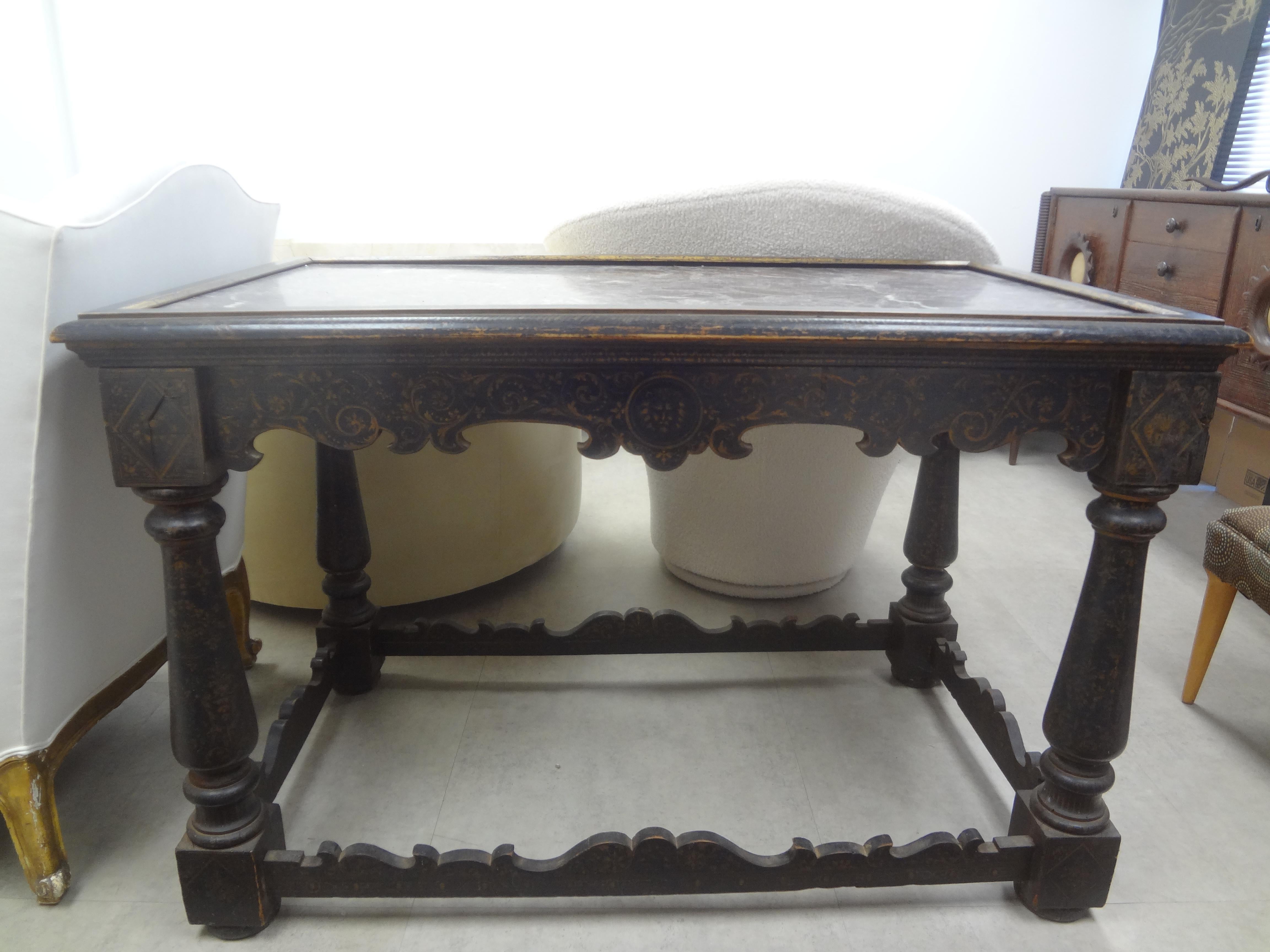 18th Century Italian Louis XIV Ebonized Table.
Our handsome rectangular period 18th century Tuscan ebonized fruitwood table, side table or center table has turned legs, a beautifully carved hand decorated apron and stretcher with an unusual framed