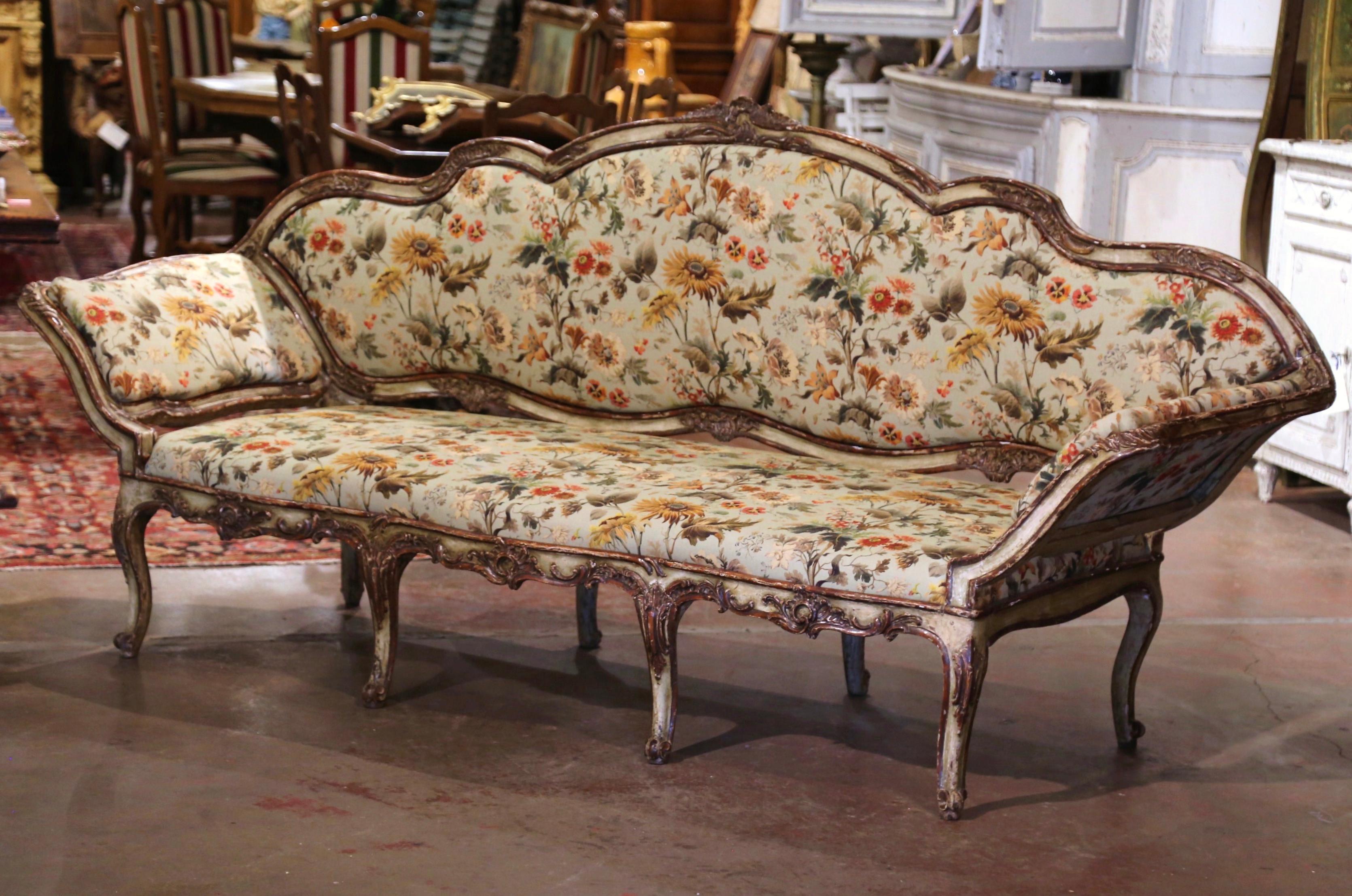 This elegant, antique painted settee was crafted in Italy, circa 1780. The classic Italian, Louis XV style sofa features a shaped back with ear sides; the cushioned portions of the back and armrests are removable for easy re-upholstery, and are