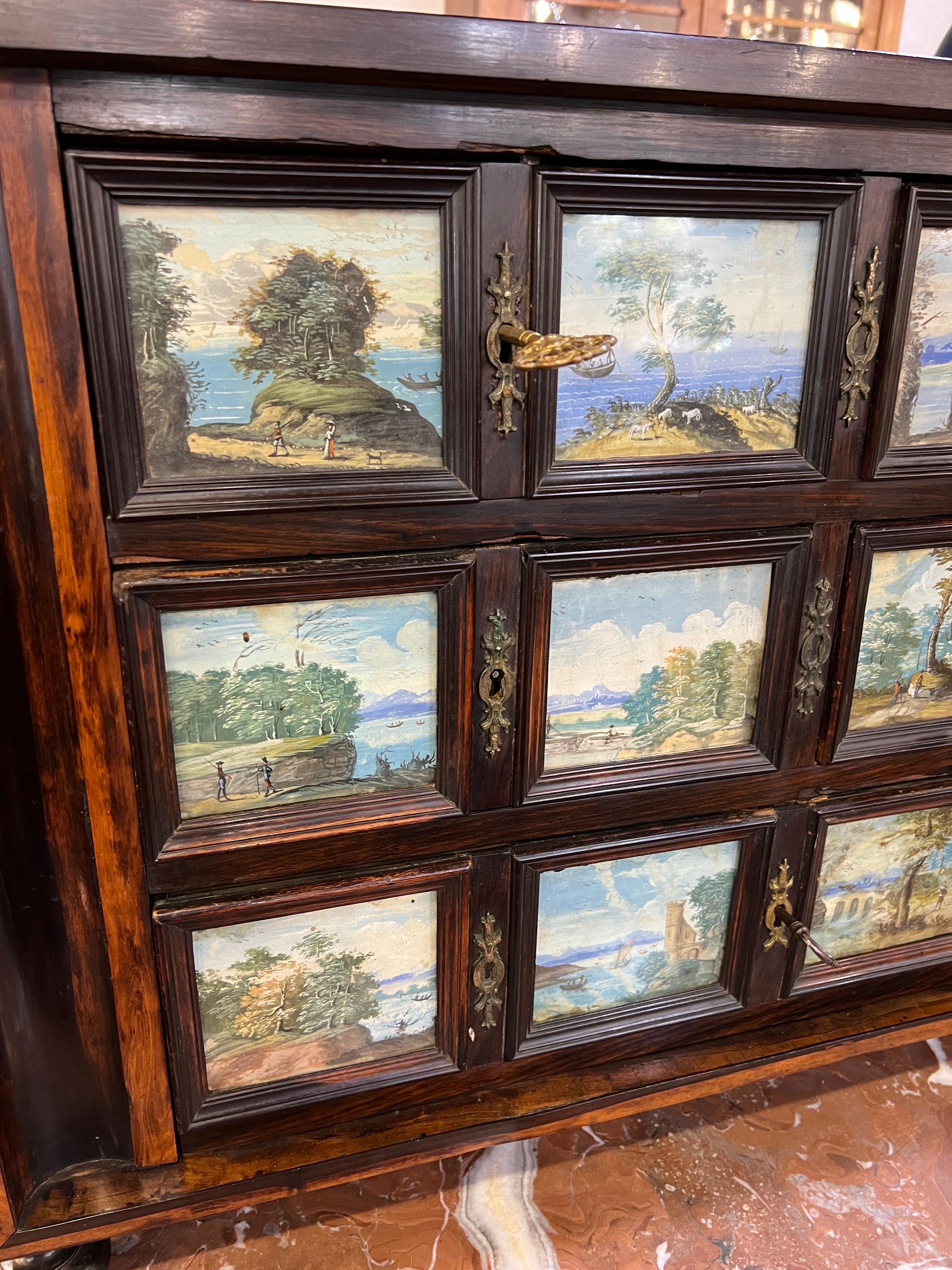 Antique 18th-century Italian ebonized walnut coin cabinet with paintings under glass , Naples mid-1700s , on each drawer there are paintings depicting the Bay of Naples, Vesuvius and the bucolic part around the city. Fine piece of furniture and in