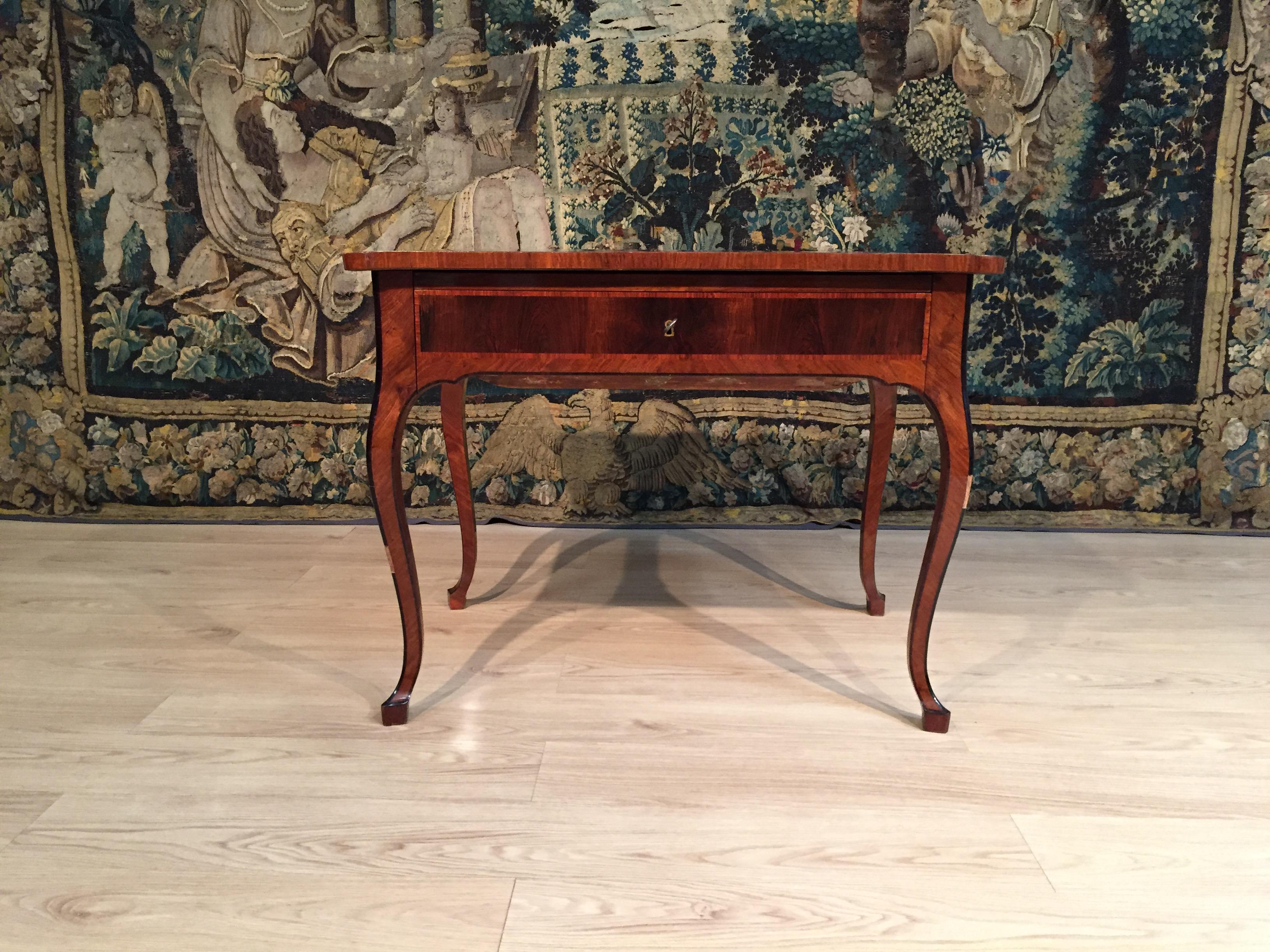 18th century, Italian Louis XV wood center desk

This elegant Louis XV desk, made in Tuscany, Italy, in the 18th century, is paved with several precious wooden essences, such as rosewood, bois de rose, walnut and, for the interiors, olive wood.