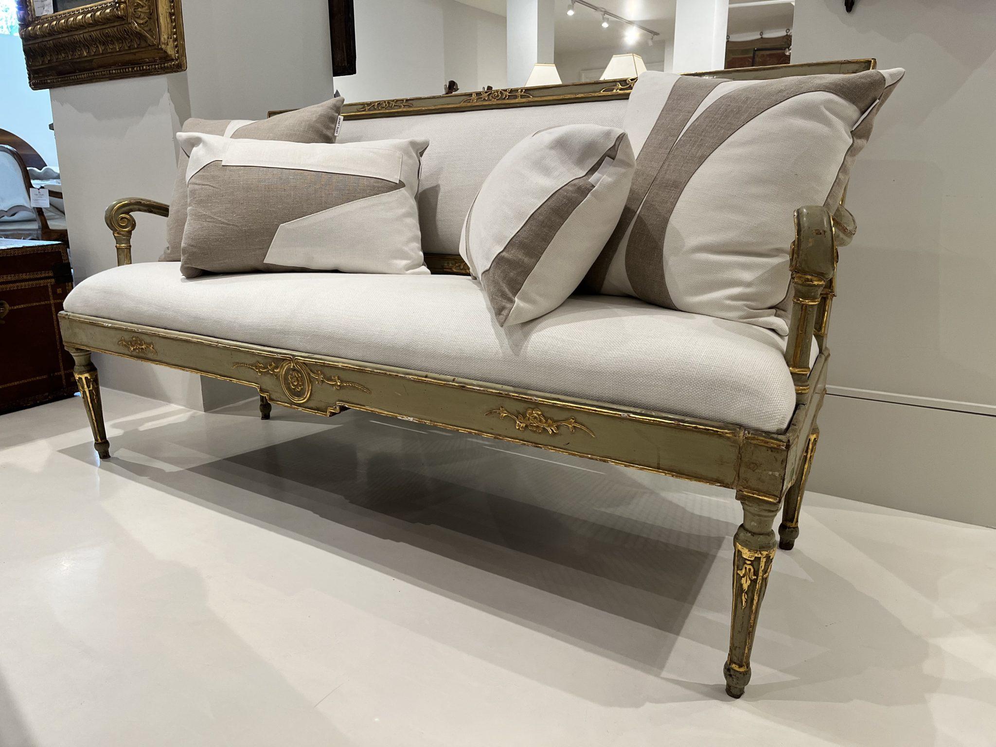 18th Century bench with exquisitely carved wood with gilded detail. Pale green lacquer enhanced by white Belgian Linen upholstery. Elegant addition to any room.