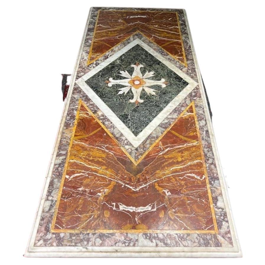 Magnificent polychrome marble top of Italian origin, Louis XVI period, about 1780, this type of top was called Paliotto, this marble work was characterized by inlays of colored marbles, sometimes imitated by scagliola. In particular on this Paliotto