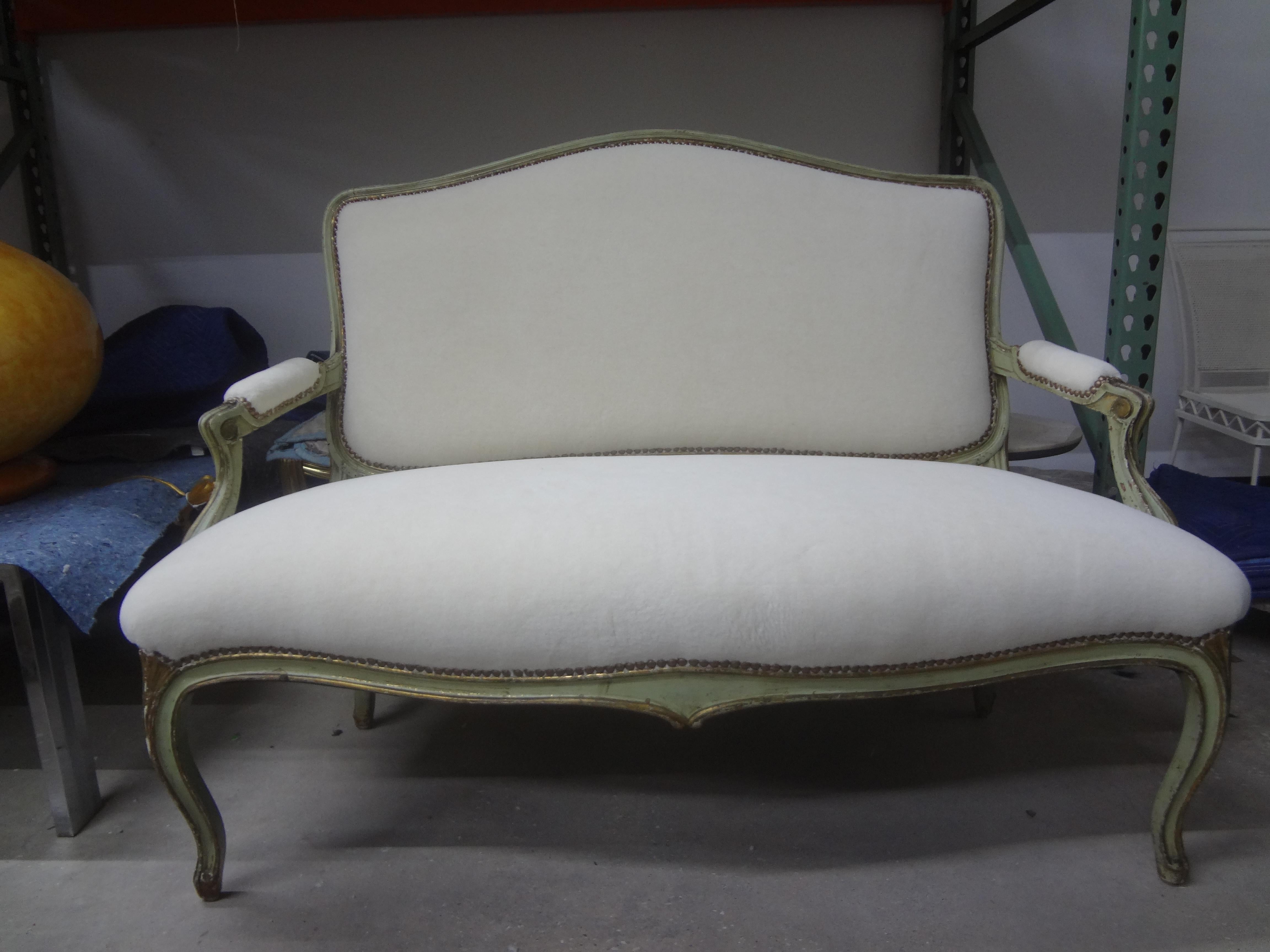 18th century Italian Louis XVI painted and parcel gilt loveseat.
18th century Italian Louis XVI painted and parcel gilt loveseat, sofa, settee or divanetto. This stunning Italian loveseat has been professionally upholstered in a plush low pile